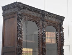 Renaissance revival carved oak two door bookcase