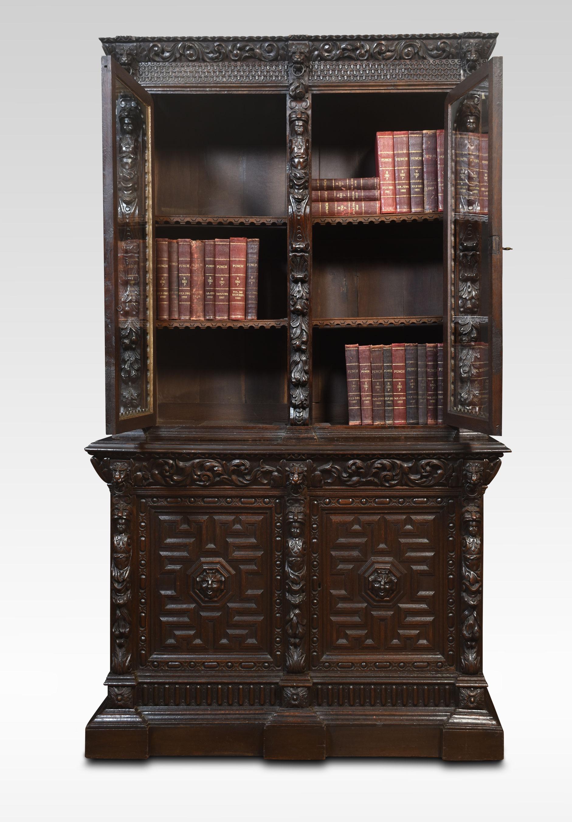 British Renaissance Revival Carved Oak Two Door Bookcase For Sale