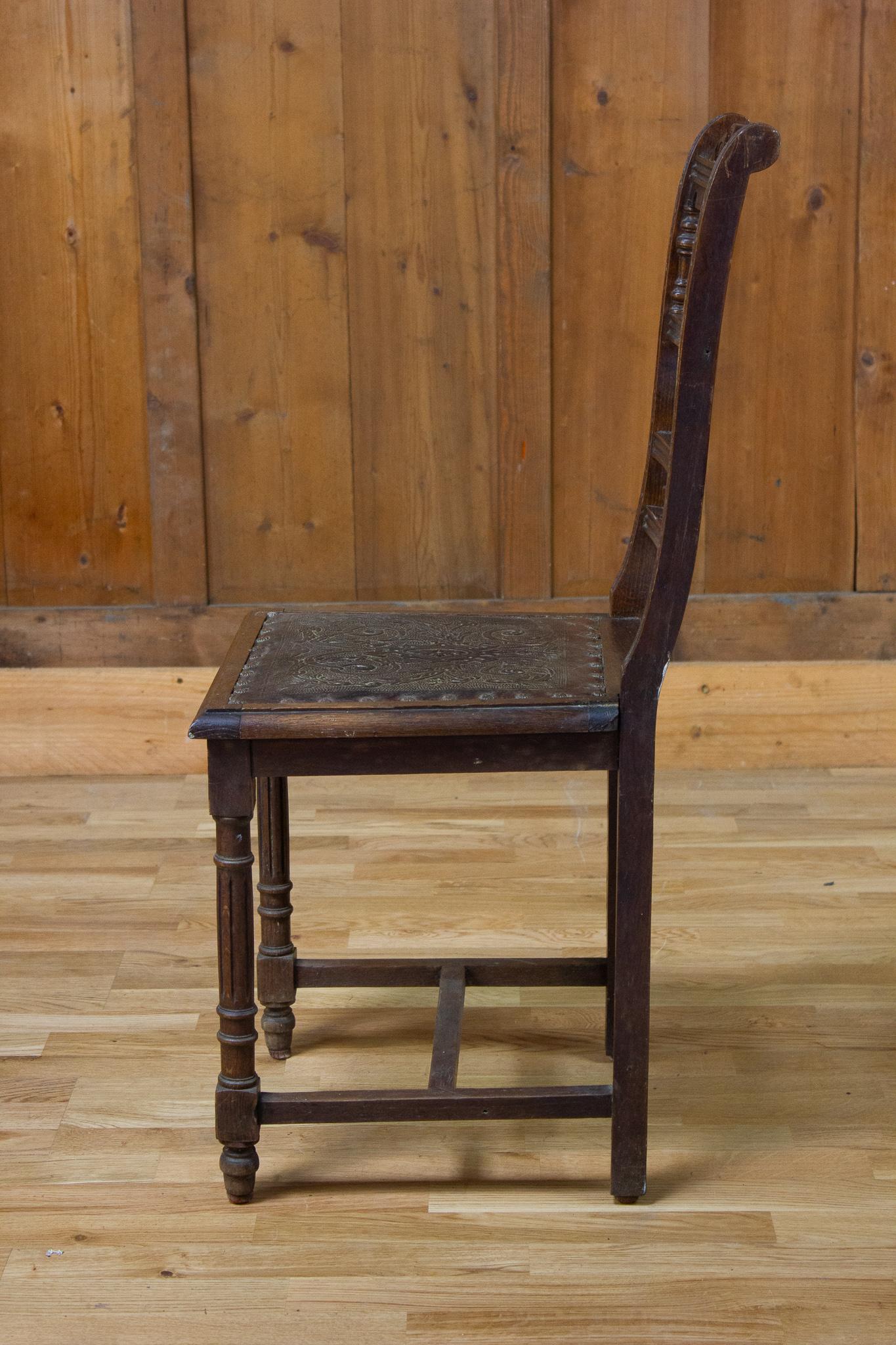 Nice chair of Henri II style dating from the 19th century. It has a straight base connected by a strut. Its seat is in leather. Its back is completely carved with architectural motifs mainly columns. 

France 
XIXth century.