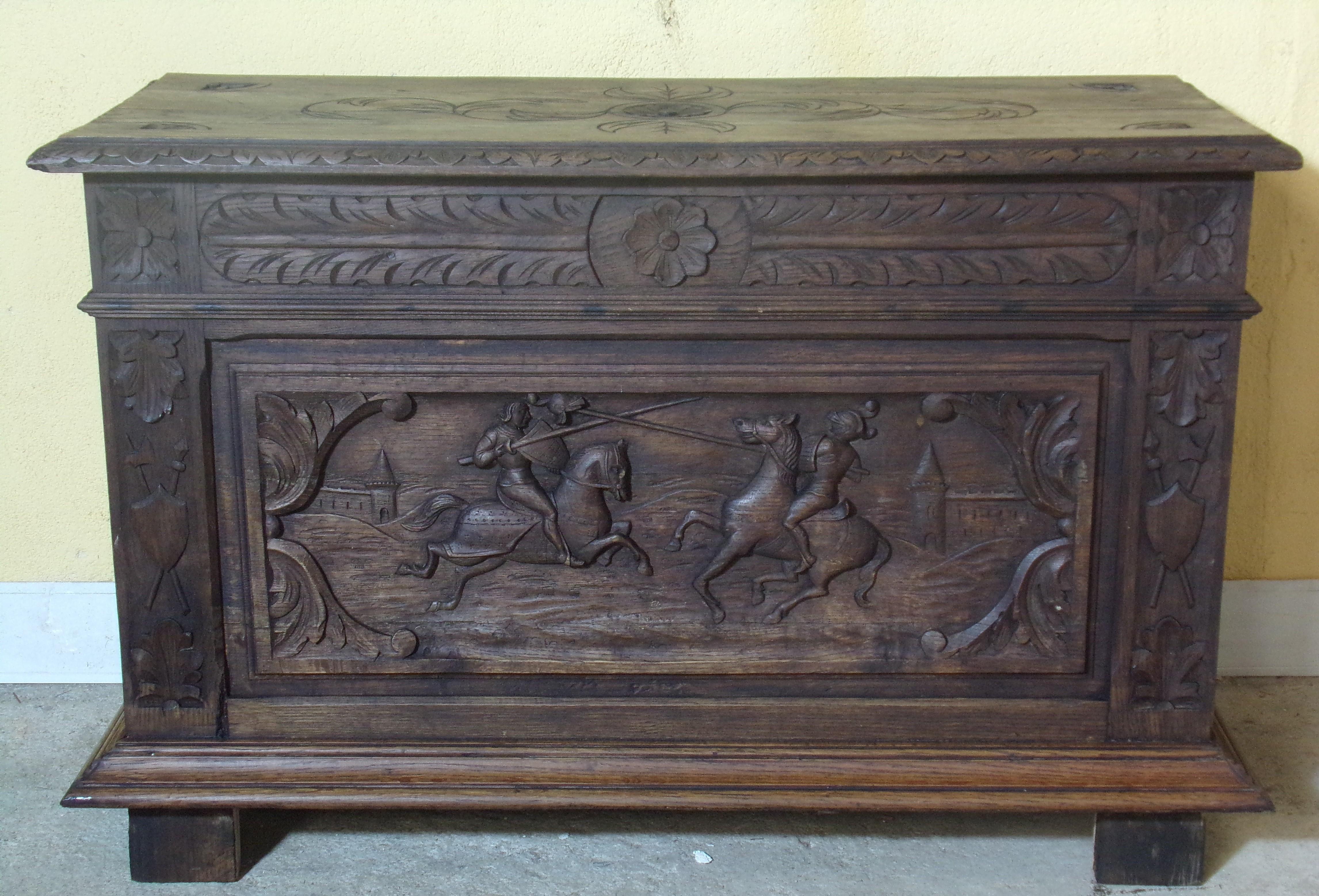 A most unusual hand carved oak coffer depicting Jousting Knights in the Renaissance Revival style, C 1880.
