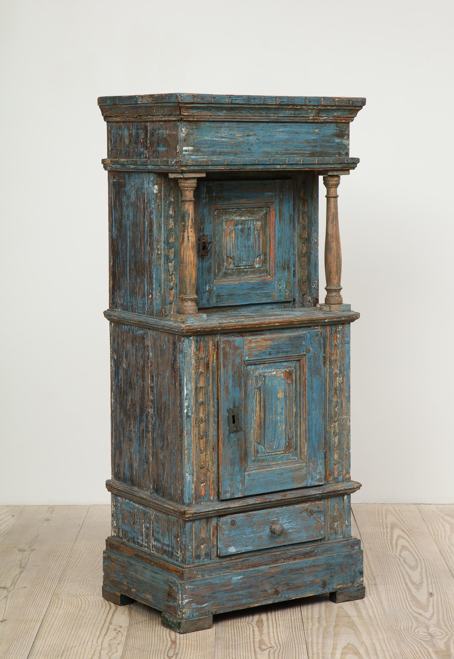 Charming, Danish Renaissance Revival cabinet, origin: Denmark, circa 1750, with upper and lower doors and lower drawer all in original blue paint and red interior.

Similar style cabinets can be seen in Rosenberg Castle (Rosenborg Slot) - a