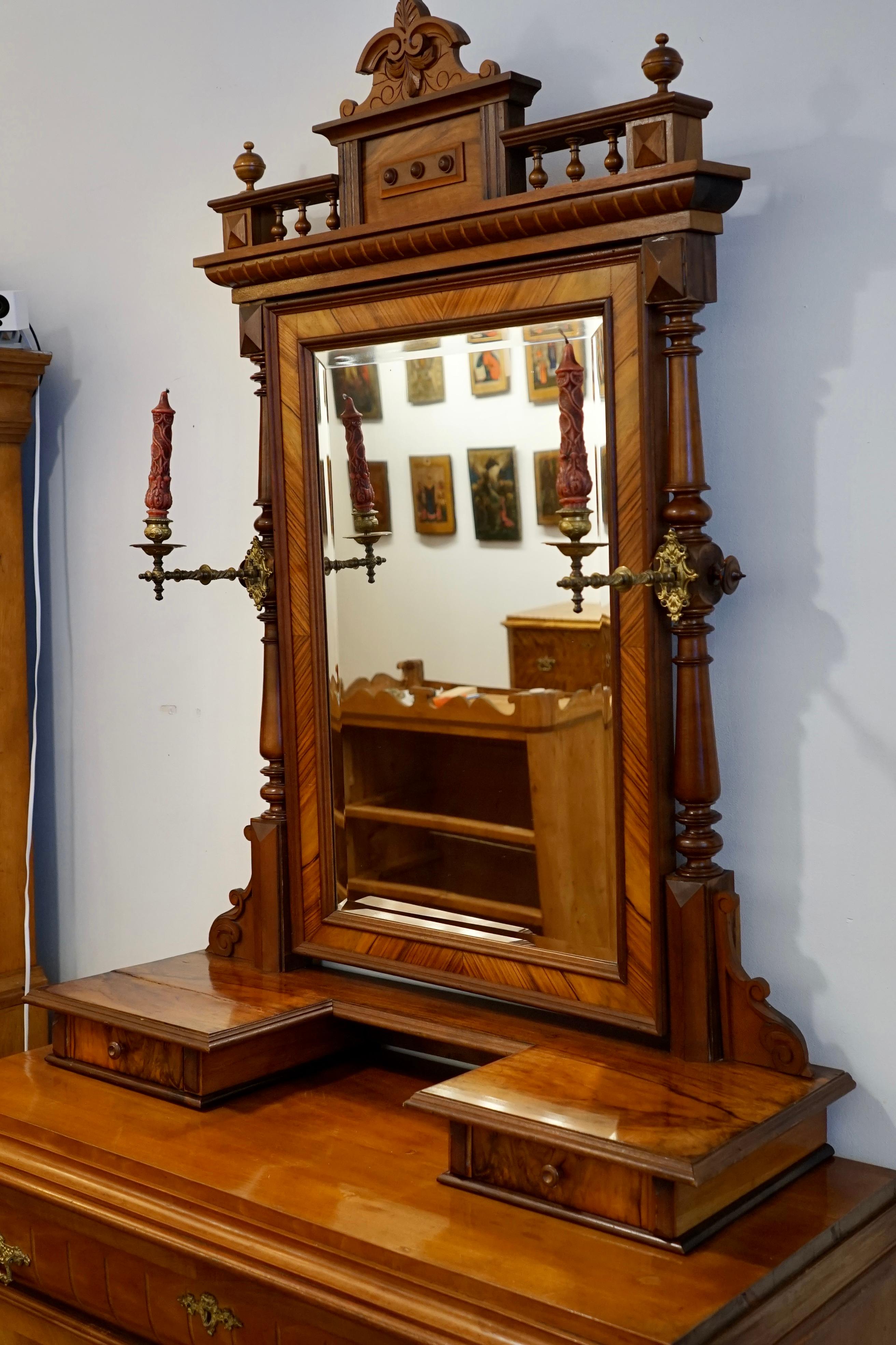 Combining the late 19th century forms of the Renaissance Revival period with spacious functionality. Constructed of fir and birch with mahogany inlays on all facing surfaces. This dresser has been fully refinished. All drawers, locks and keys are in