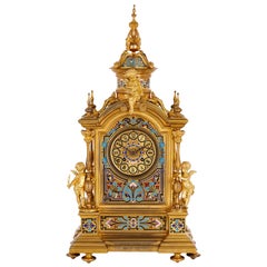 Reloj de chimenea renacentista de esmalte y bronce dorado