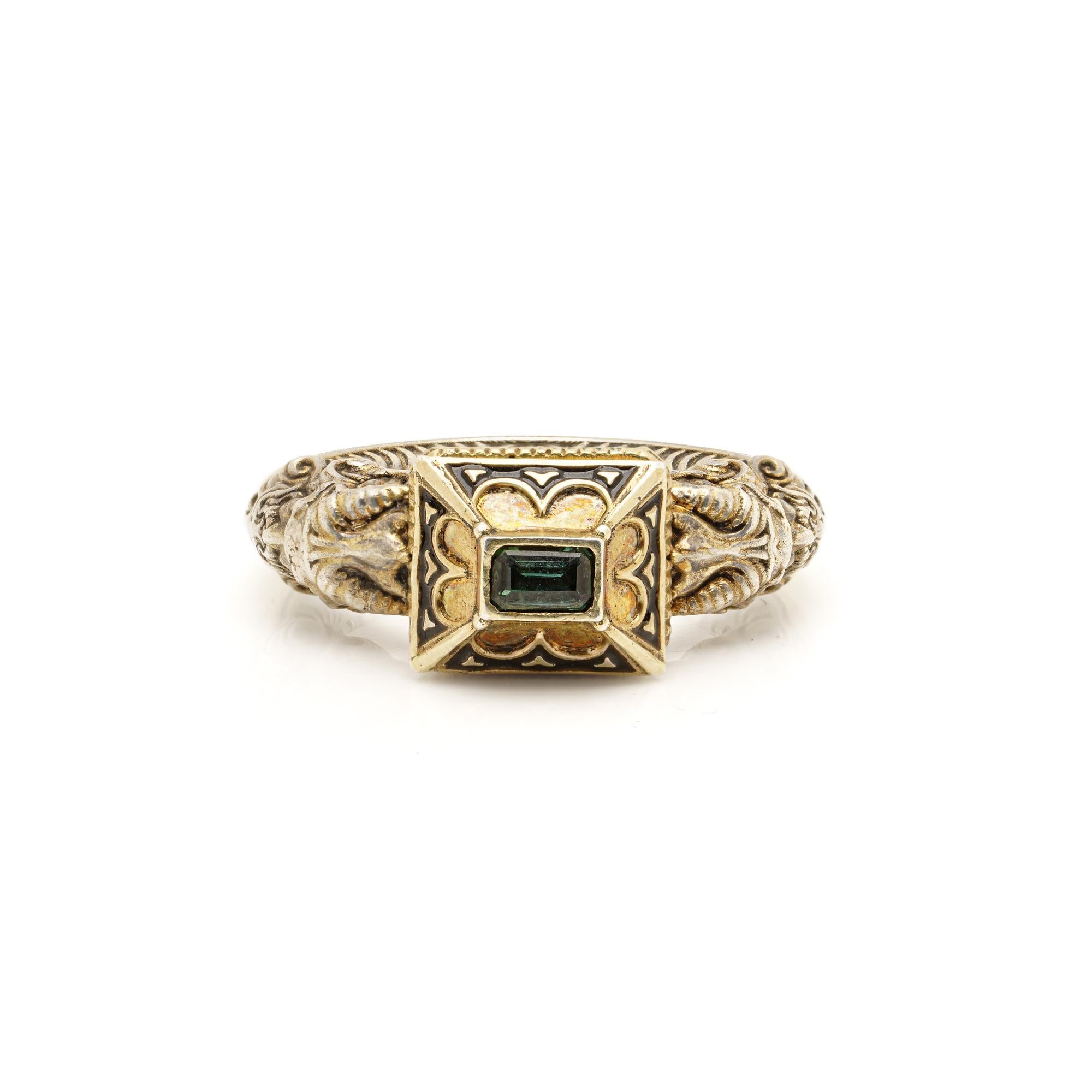 A rare 19th century Renaissance Revival ring crafted in gold and silver, featuring a green tourmaline, intricate enamel work, and sculptural satyr heads. A striking collector’s piece showcasing revivalist craftsmanship.

Dimensions &