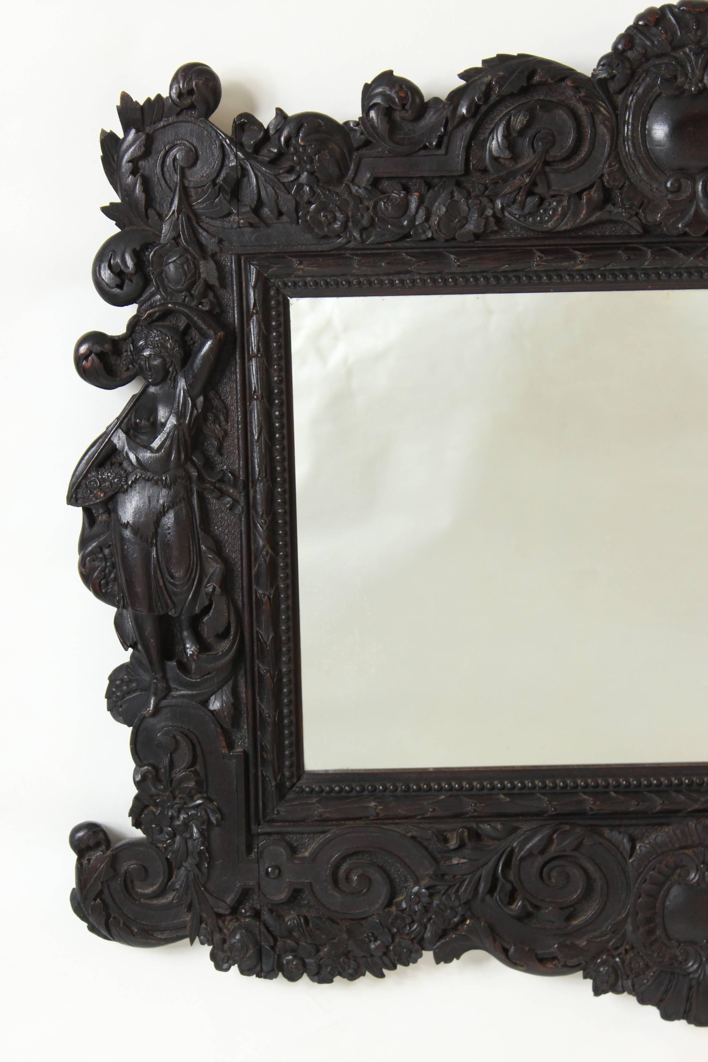 Renaissance Revival carved mahogany mirror, late 19th century.