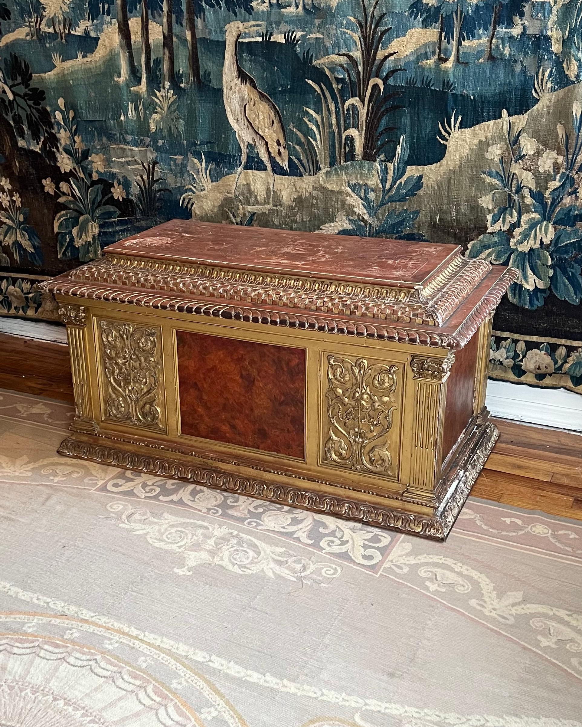 A grand Renaissance Revival coffer in the the style of 15th century Florence. The intricately carved and scribed lid with gadrooned edge displays a pomegranate motif originating from the Ottoman Empire and popular in Medieval and Renaissance Italy.