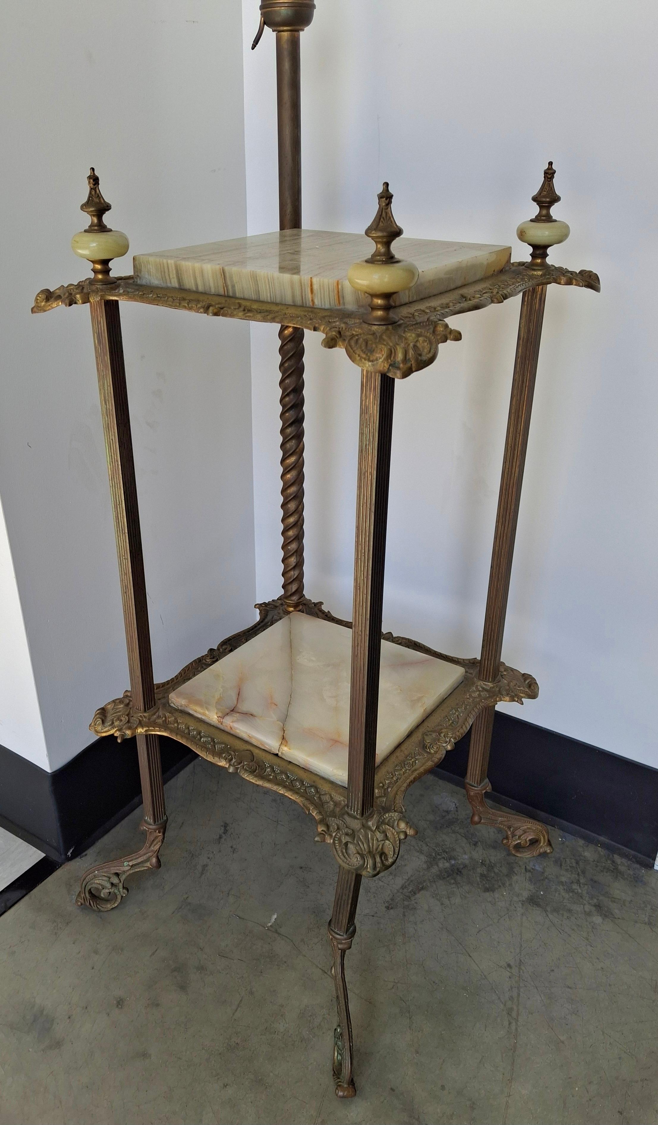 A Renaissance Revival Style Cast Brass and Onyx Top Table with Adjustable Oil Lamp. 
MEASUREMENTS: 19″ wide x 19