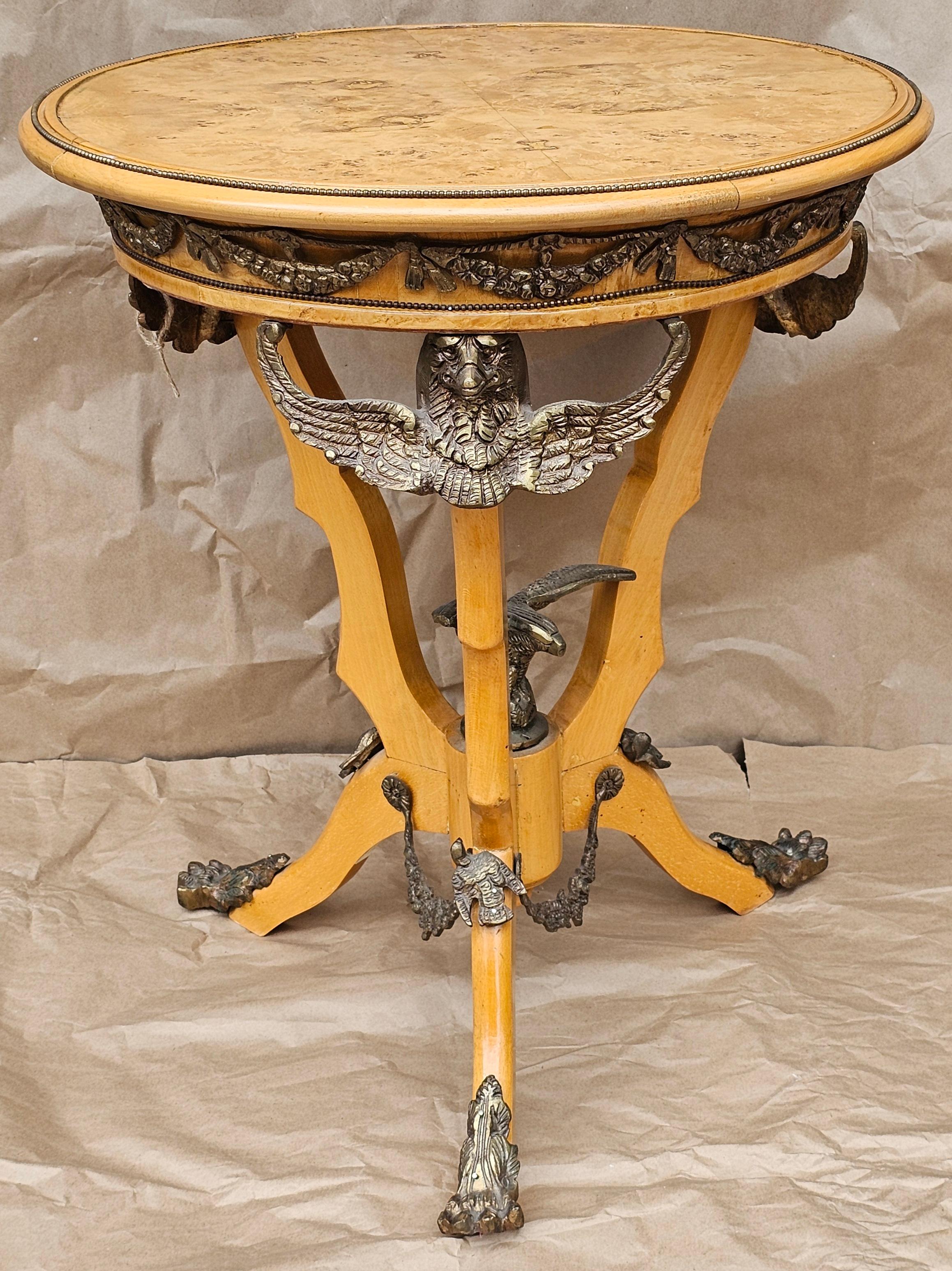A Renaissance Revival Style Ormolu Mounted Burlwood Side Table
Measures 24.25