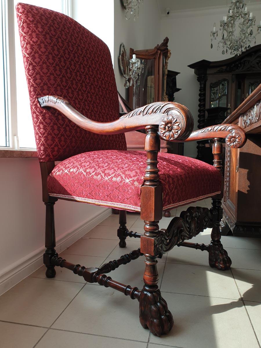 A spectacular and representative armchair - a throne, made in the early twentieth century in solid, dark wood and finished (seat and back) with beautiful, Classic upholstery, perfect for this type of furniture.
Noteworthy is the high class of