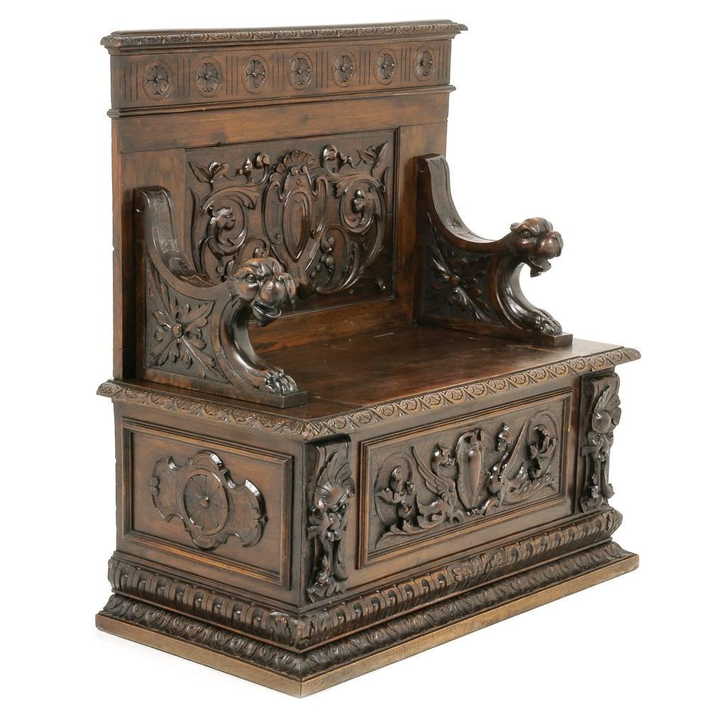 Unusual, highly carved, 19th century solid walnut hall bench of smaller proportions. Measure: Only 44 wide. Circa 1880.