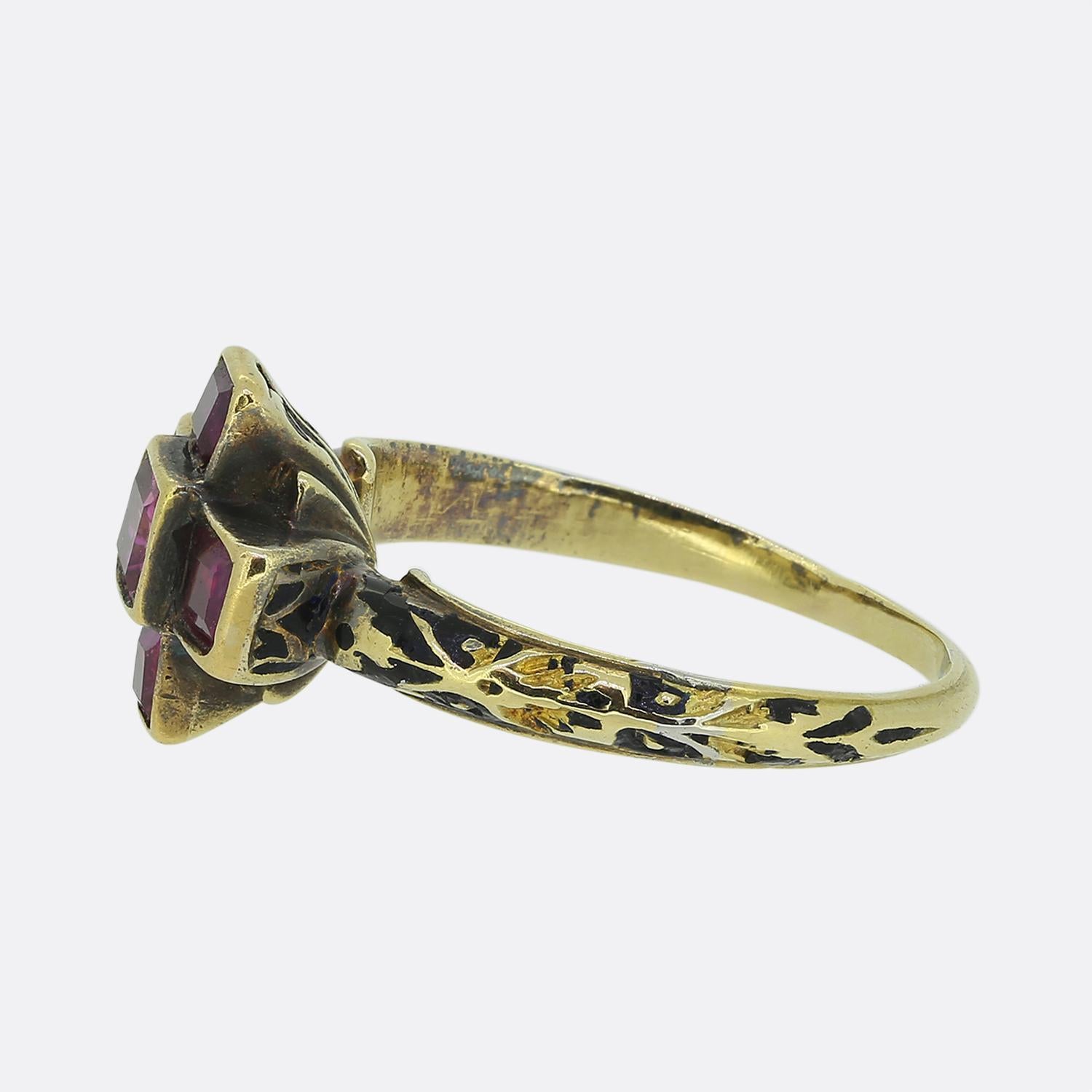 Here we have a rare example of an original late Renaissance ring. This antique piece has been crafted from a warm yellow gold and plays host to five perfectly matched square shaped pink rubies in cruciform. Ornate black enamel work can be found at