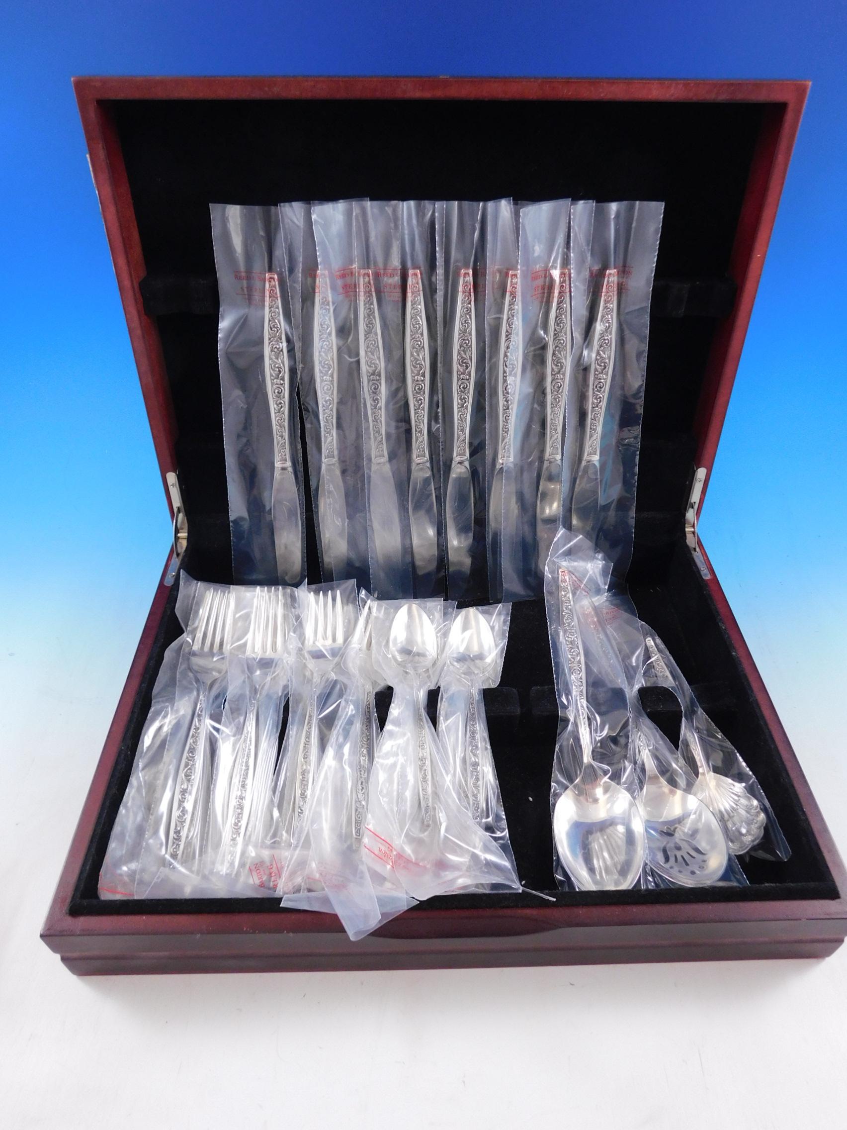Unused Renaissance scroll by Reed and Barton sterling silver flatware set - 35 pieces. This set includes:

8 knives, 9 1/8