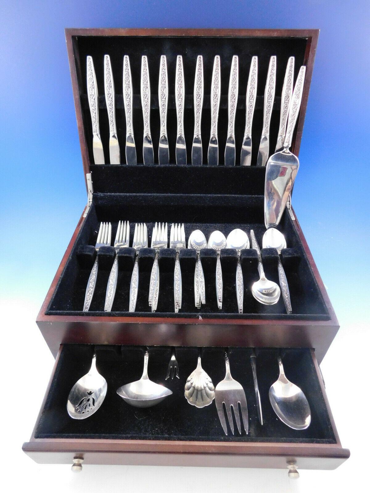 Renaissance Scroll by Reed and Barton, circa 1969 Sterling Silver Flatware set - 68 pieces. This set includes:

12 Knives, 9 1/8