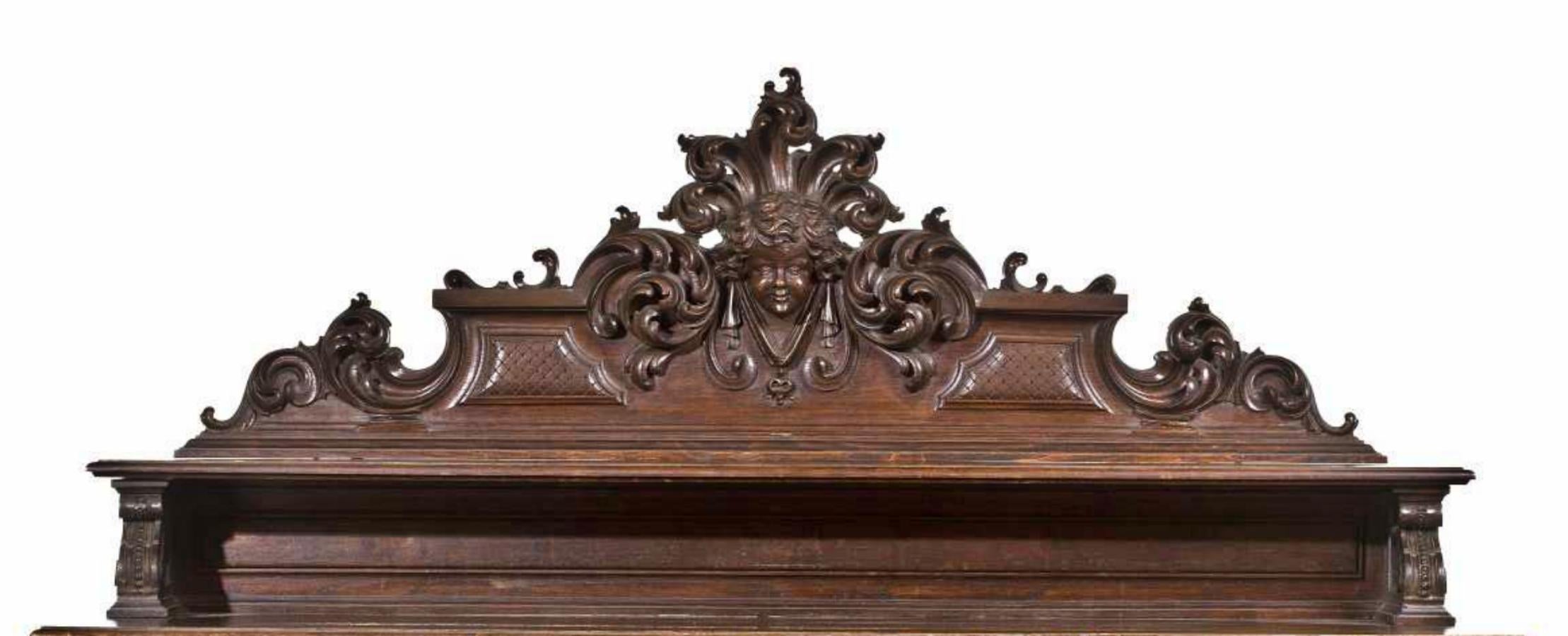 Sideboard
Renaissance style
end 19th century
in carved brown.
An elevation cutout of a shelf, topped by a cherub.
Lower body with three doors decorated with plant elements and cherubs.
Failures.
Dimensions: 161 x 173 x 66 cm.