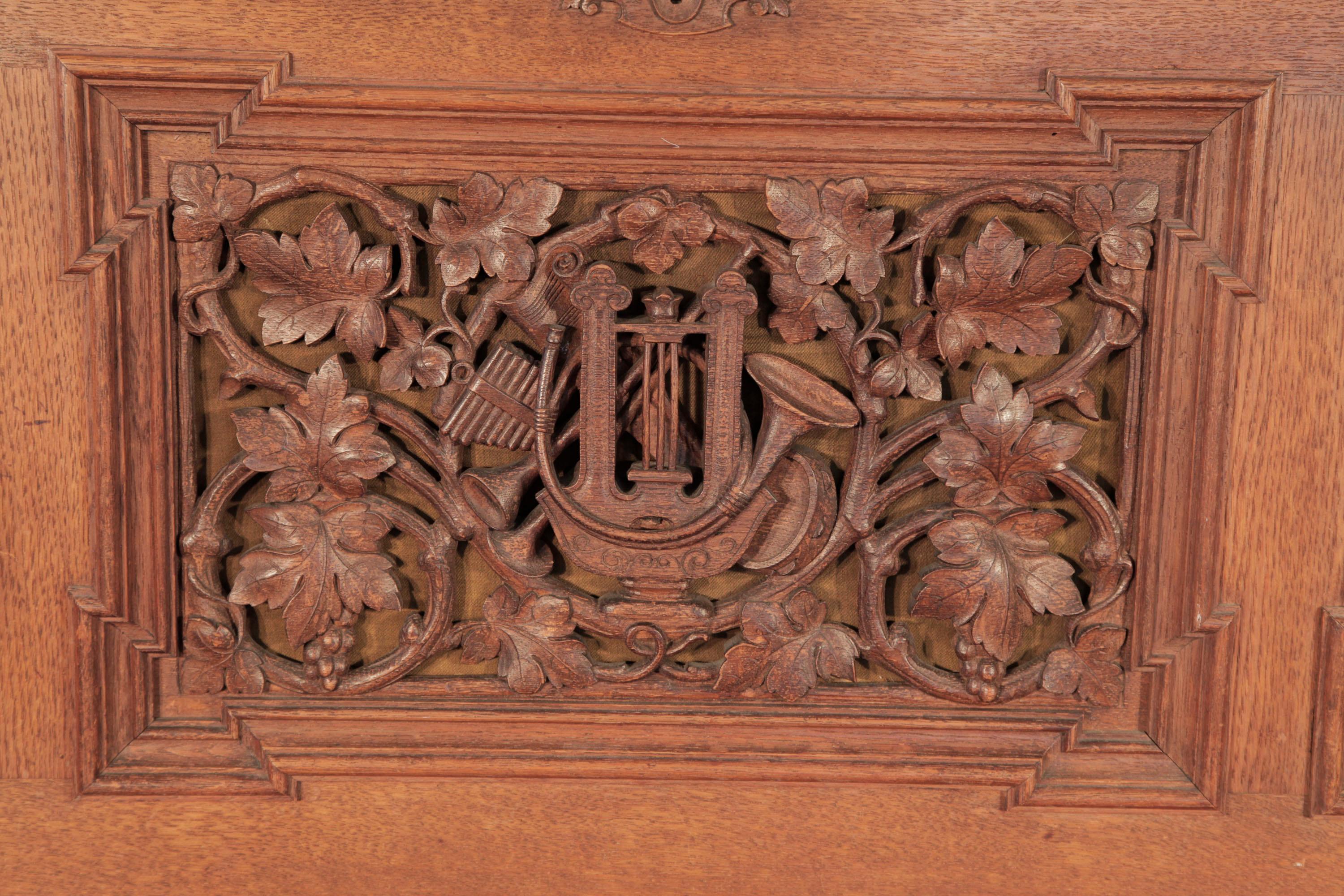 Renaissance style, 1871, Biese Hof upright piano in polished, oak with twisted, barley sugar legs. Entire cabinet features ornately carved, openwork panels in high relief featuring naturalistic depictions of intertwining vines, grapes and foliage