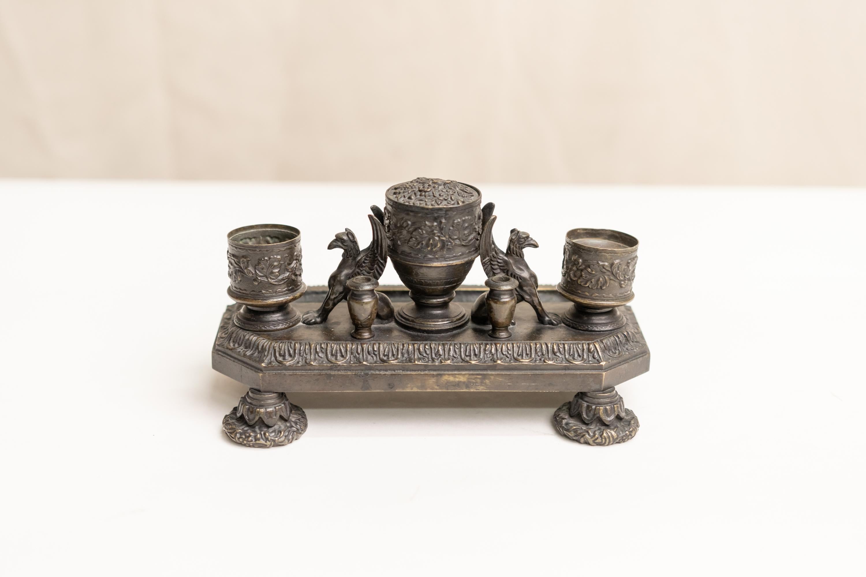 Renaissance style bronze inkwell decorated with gryphons and floral motifs.