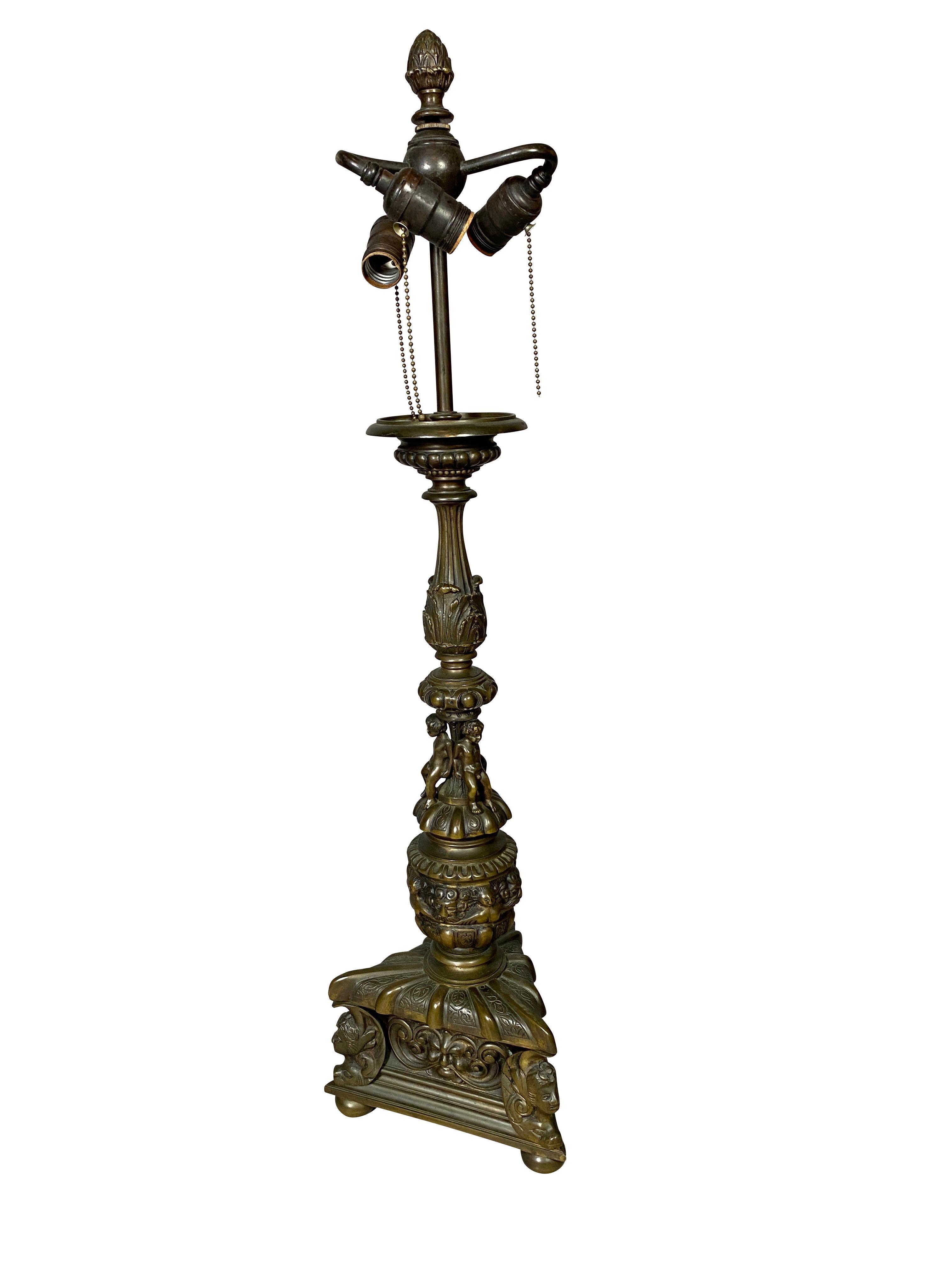 Large and heavy possibly made by Caldwell in the Italian Renaissance style. Old rich brown patina. Three light.