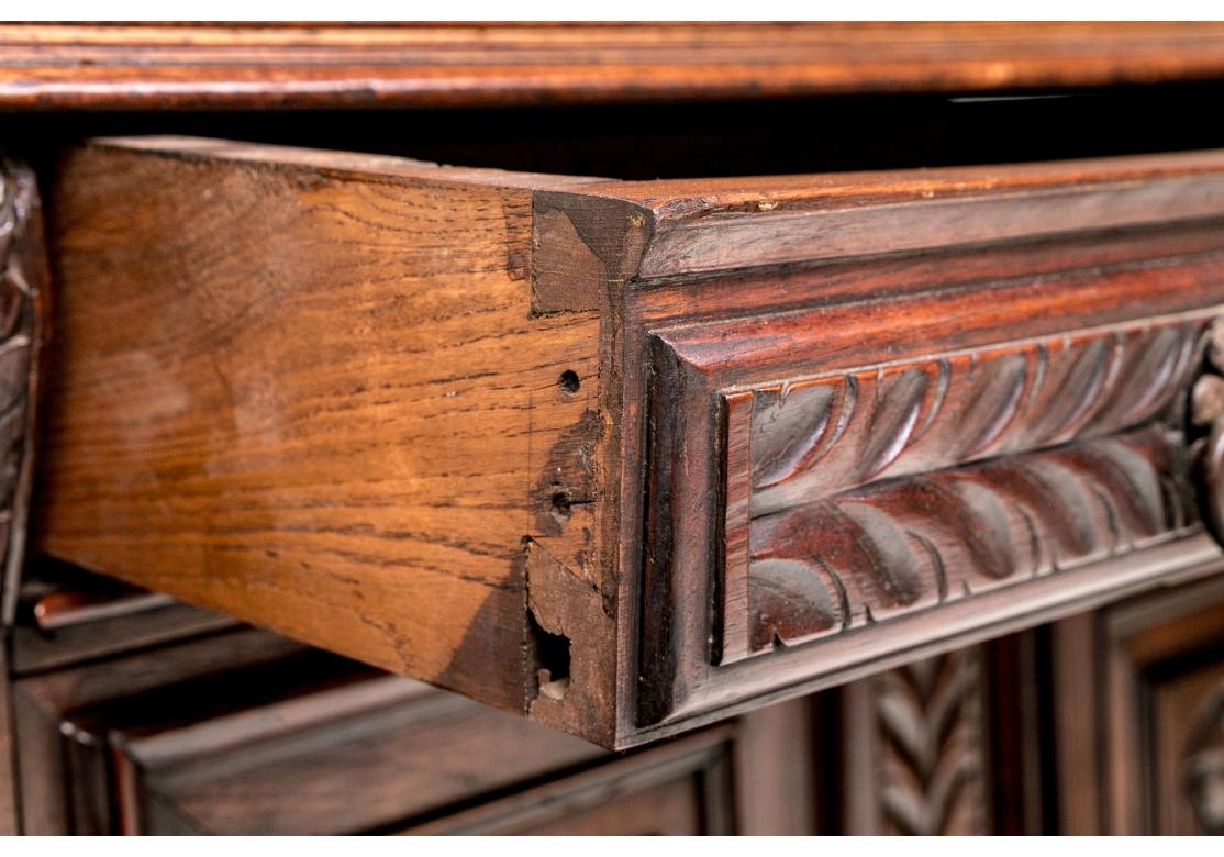 European Renaissance Style Carved Oak Two Part Cabinet With Figural Panels For Sale