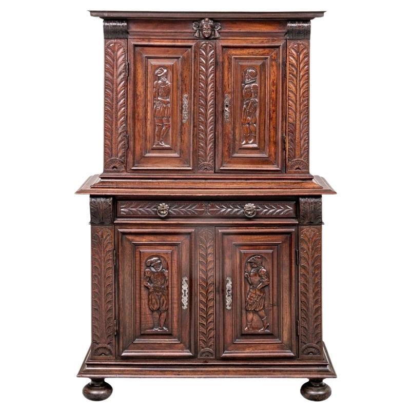 Renaissance Style Carved Oak Two Part Cabinet With Figural Panels