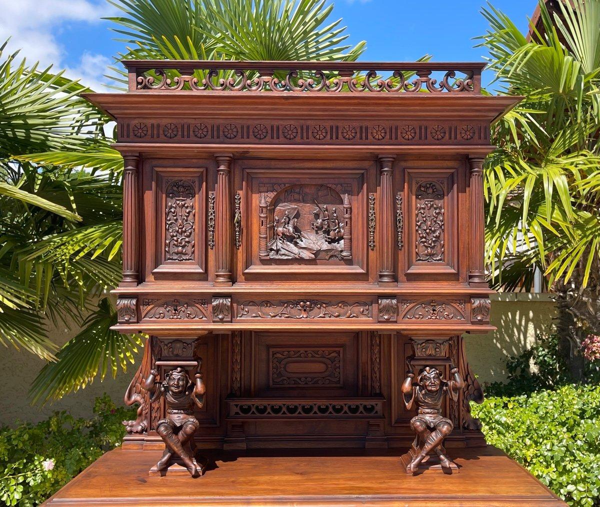 A richly carved walnut Renaissance style sideboard in good condition. Very fine French work dating from the 19th century with sculptures of winged women and jesters.
 
 Dimensions
 Height 2m29
 Width 133,5cm
 Depth 58cm