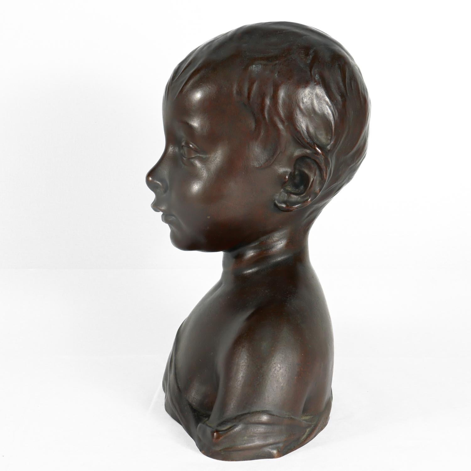 Patinated Renaissance Style Cast Bronze Bust of a Child after Desiderio For Sale