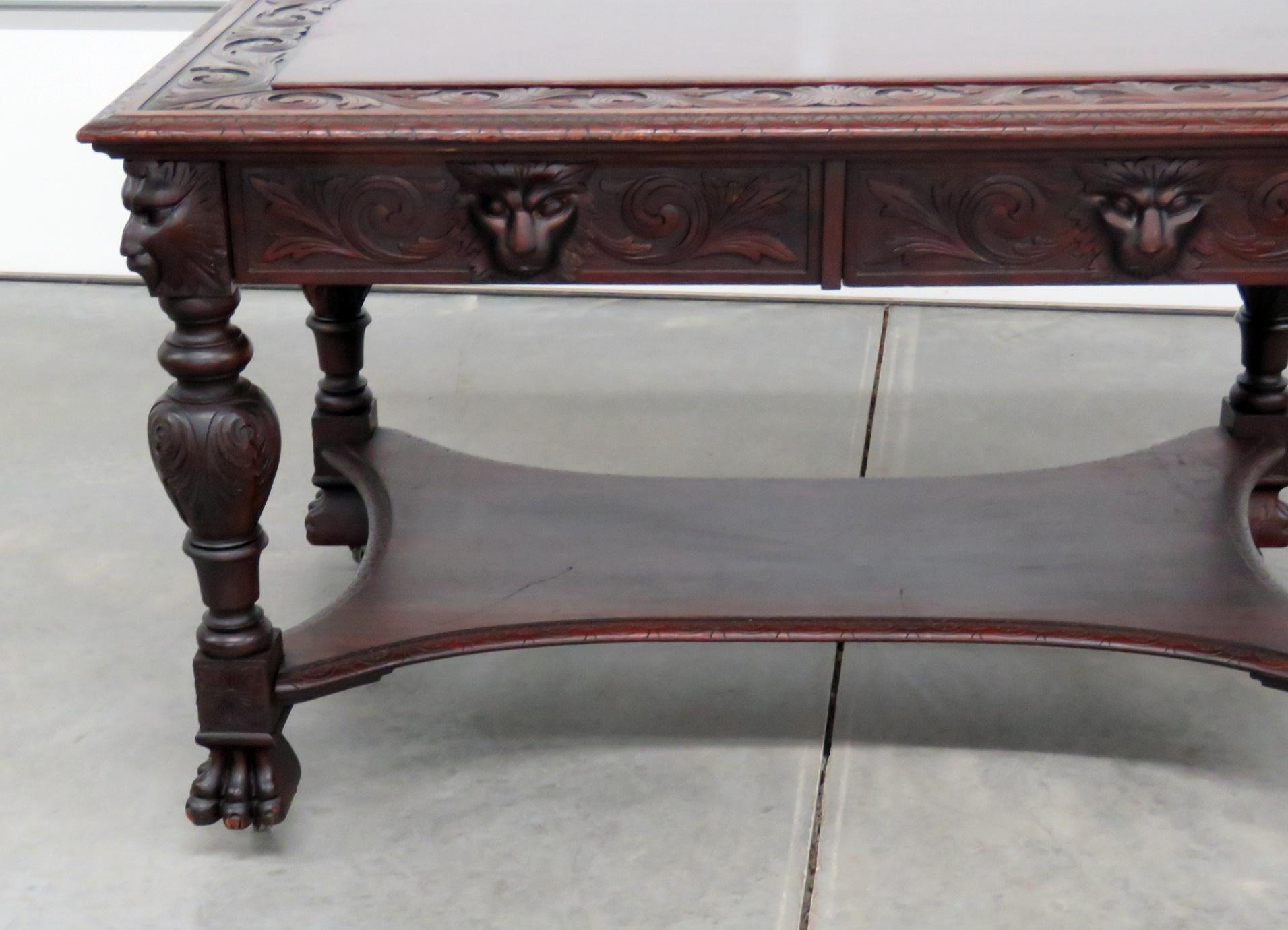 Renaissance style 2 drawer desk, attributed to J. Horner, with paw feet on casters.