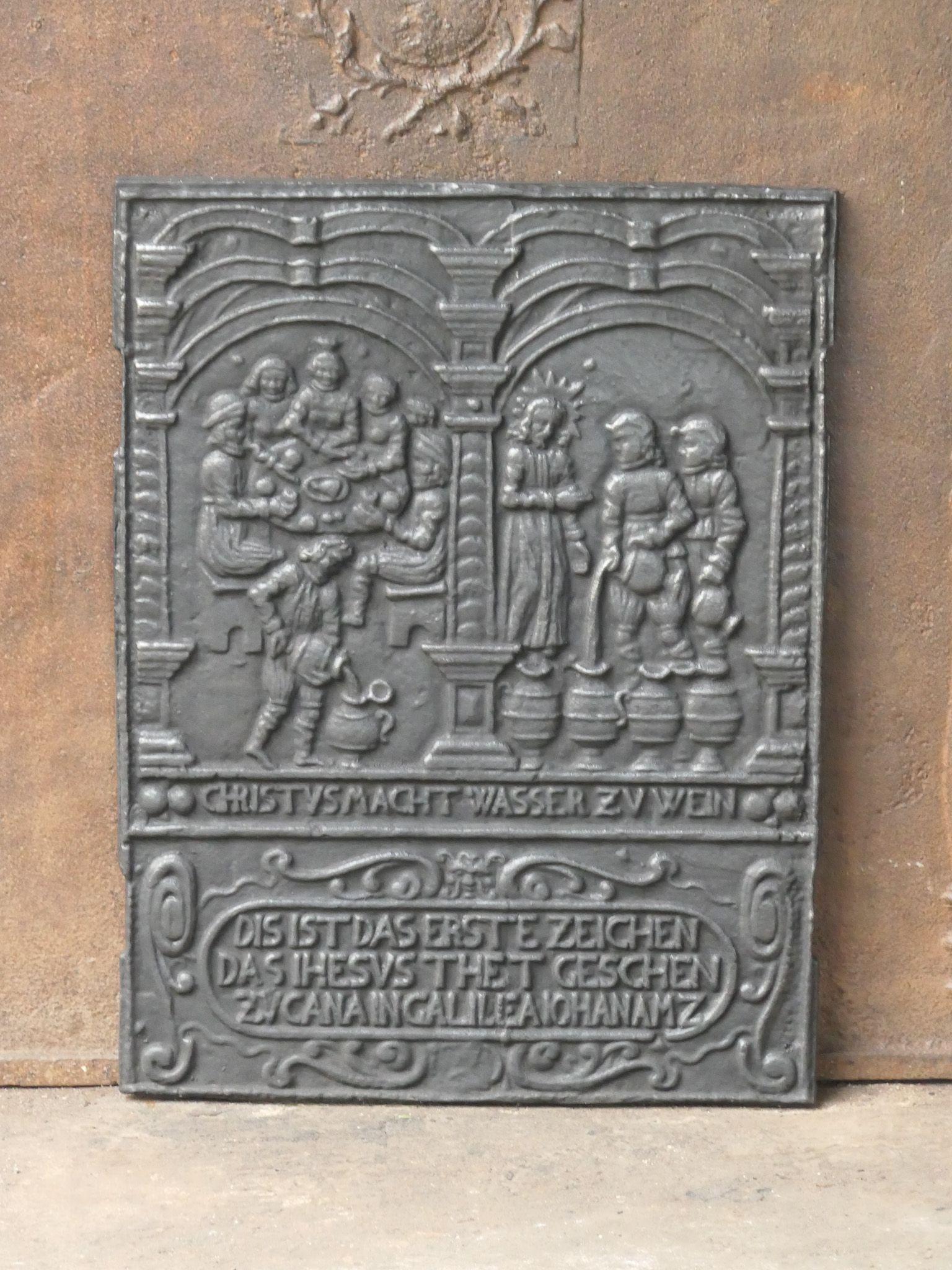 20th-century Renaissance Style 'Elisha & Widow's Oil' Fireback / Backsplash.

The fireback has a natural brown patina. Upon request it can be made black / pewter color with stove polish at no extra cost. The condition of the fireback is good and it