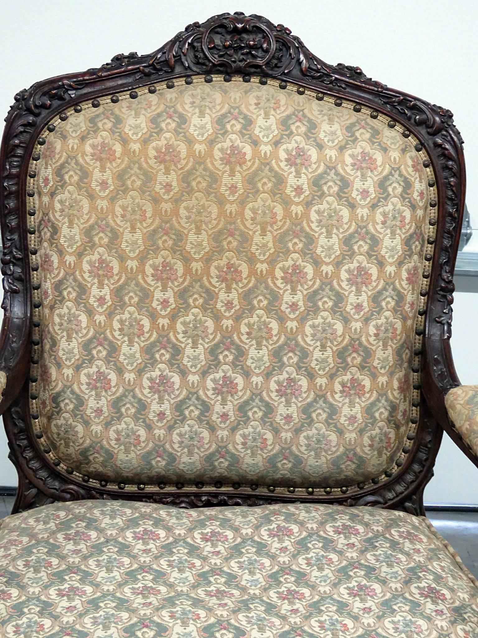Renaissance style carved mahogany fauteuil. Measure: 21