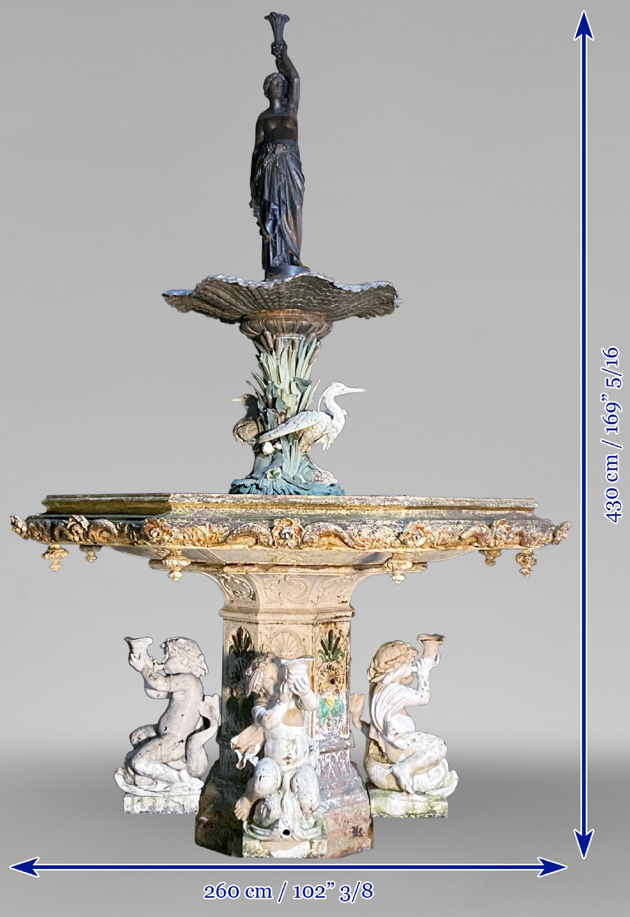 Then, it’s circa 1851, that Hubert Lavigne realizes the model of our Neo-Renaissance style monumental fountain for the Val d’Osne foundry. Resting on an octagonal foot adorned with shells and reeds in slight relief, the fountain is composed of a