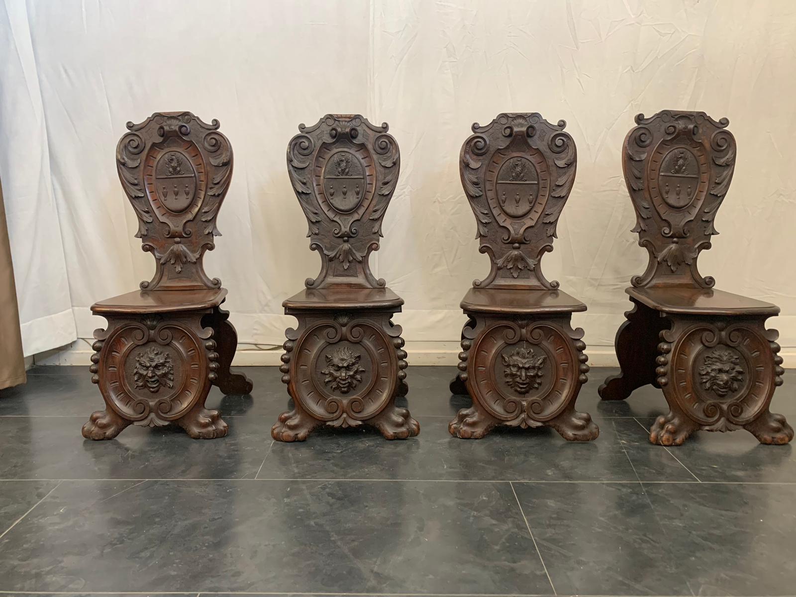 Chairs (Scranni) made of finely carved walnut to recreate volutes and decorations typical of the Renaissance style in vogue in the eclectic period of the late '800. Price for each one.