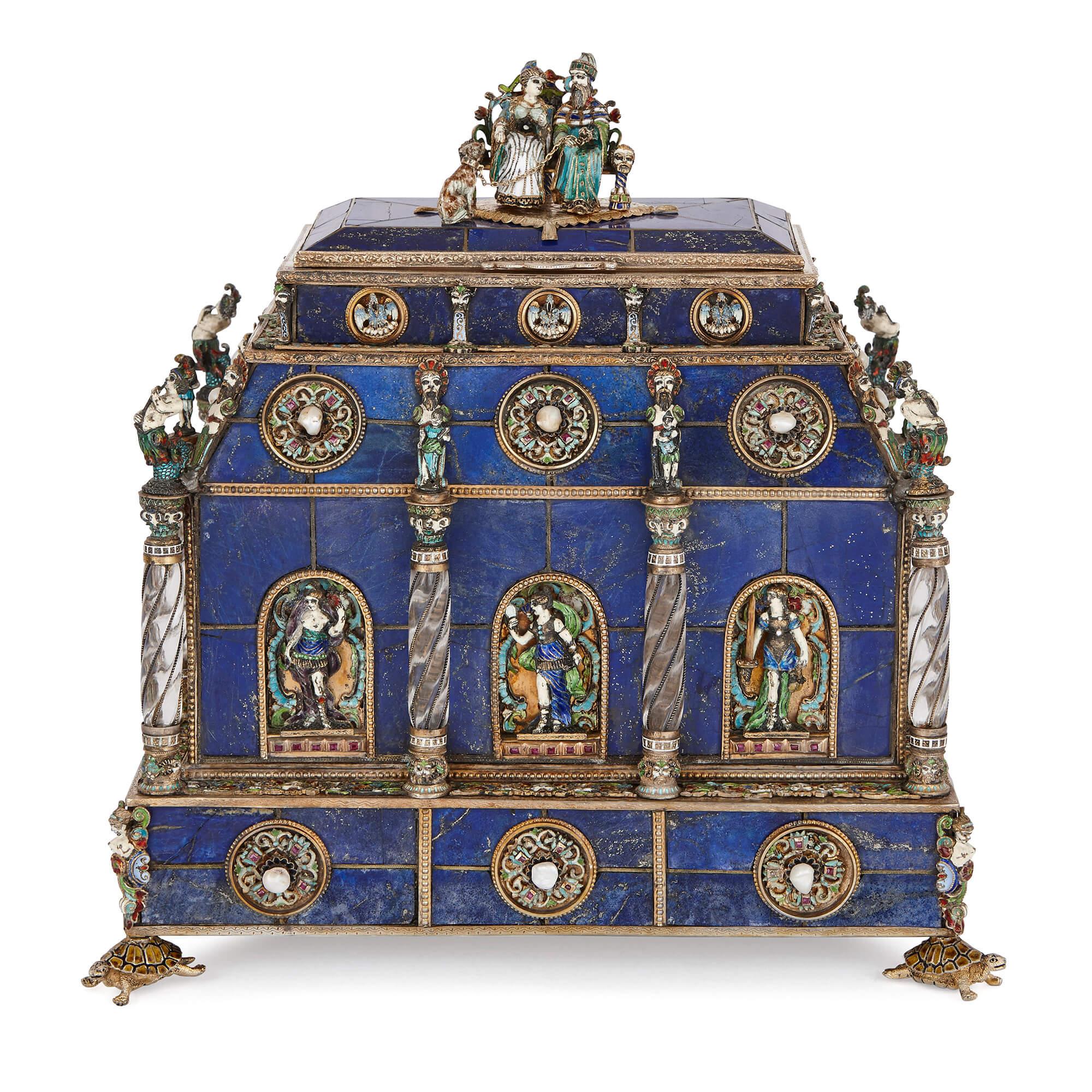 This stunning casket combines opulent materials with careful craftsmanship to produce an outstanding example of late 19th Century Viennese craftsmanship. It is built from blue lapis lazuli, and mounted with enamel, silver, rock crystal, pearls and