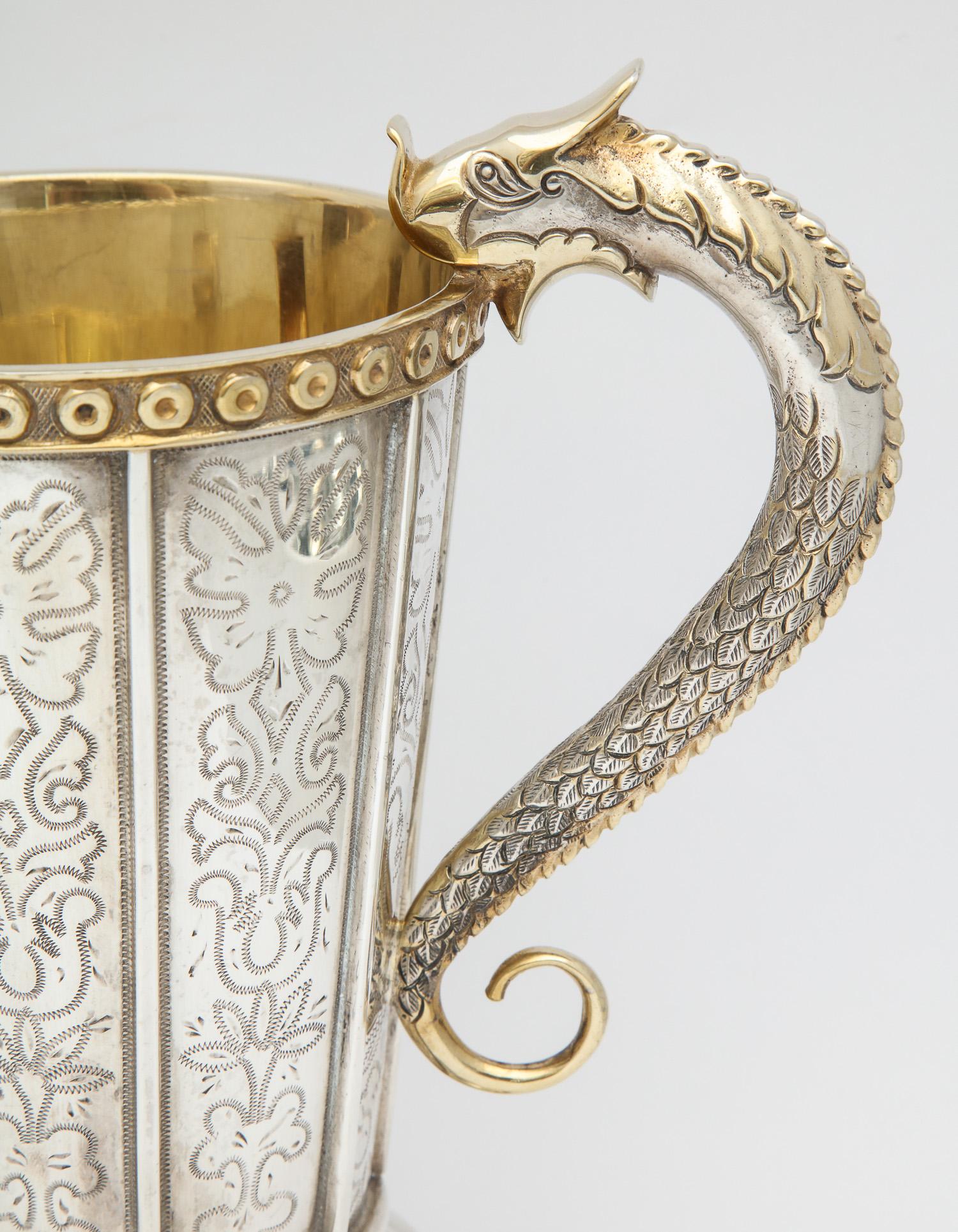 Quetzalcoatl - inspired, sterling silver parcel gilt pitcher, Mexico City, circa 1950's, Tane-maker. Quetzalcoatl was the most important Mayan god, being the creator of the world, humanity and god of the winds and rain. Pitcher has an etched design,