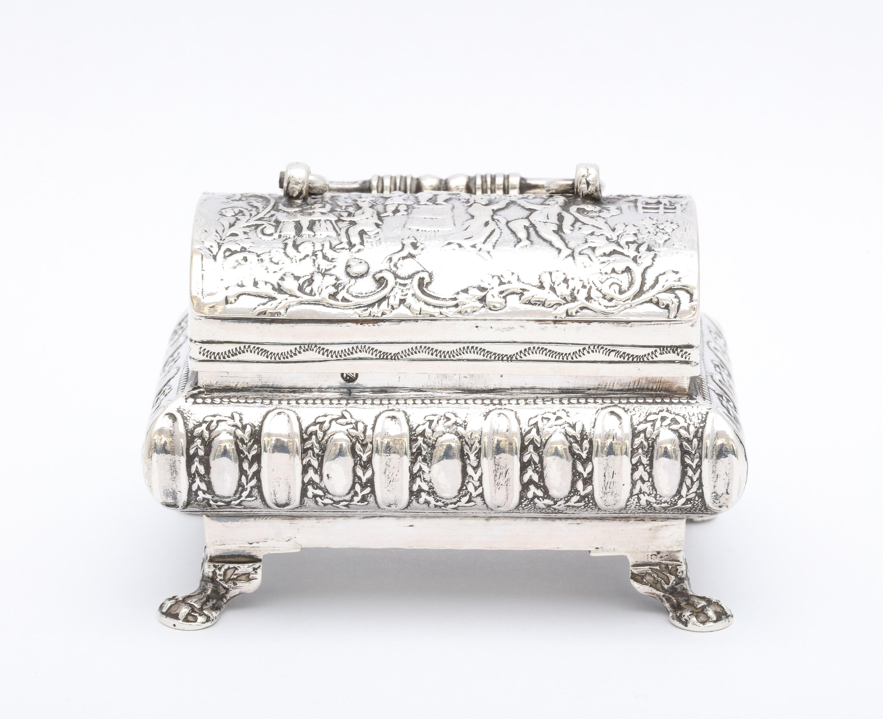 Rare, Edwardian Period, Renaissance-Style, sterling silver paw-footed trinkets box  with handle and hinged lid, made in Hanau, Germany and imported into Scotland, year-hallmarked for 1909, Berthold Miller Neresheimer - maker. Lovely scenic designs