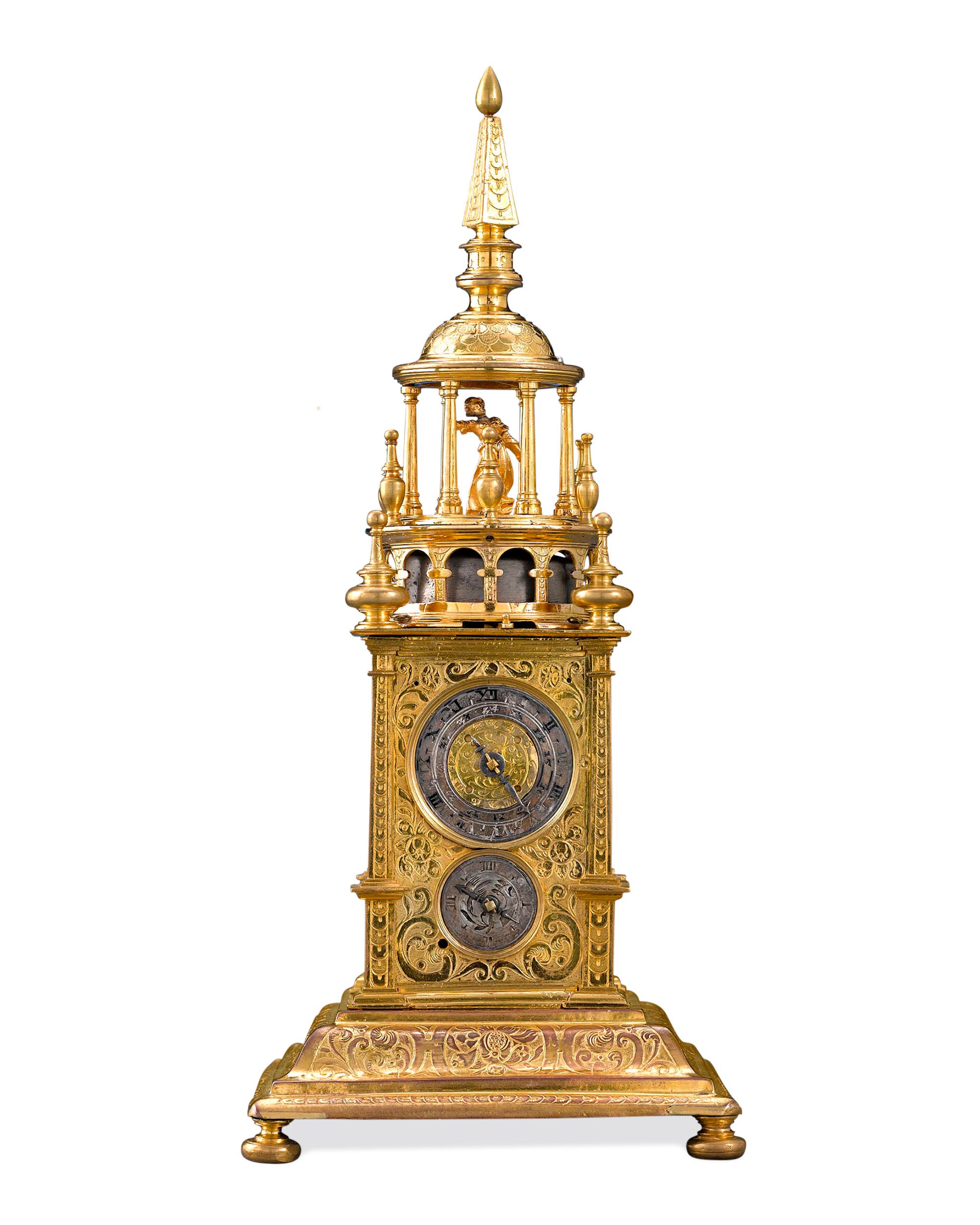 This immensely rare Renaissance turret-form clock, or the table clock, was considered both a scientific marvel and an item of luxury during the period. This incredible piece is encased in fire gilt brass crafted to resemble the giant striking clocks