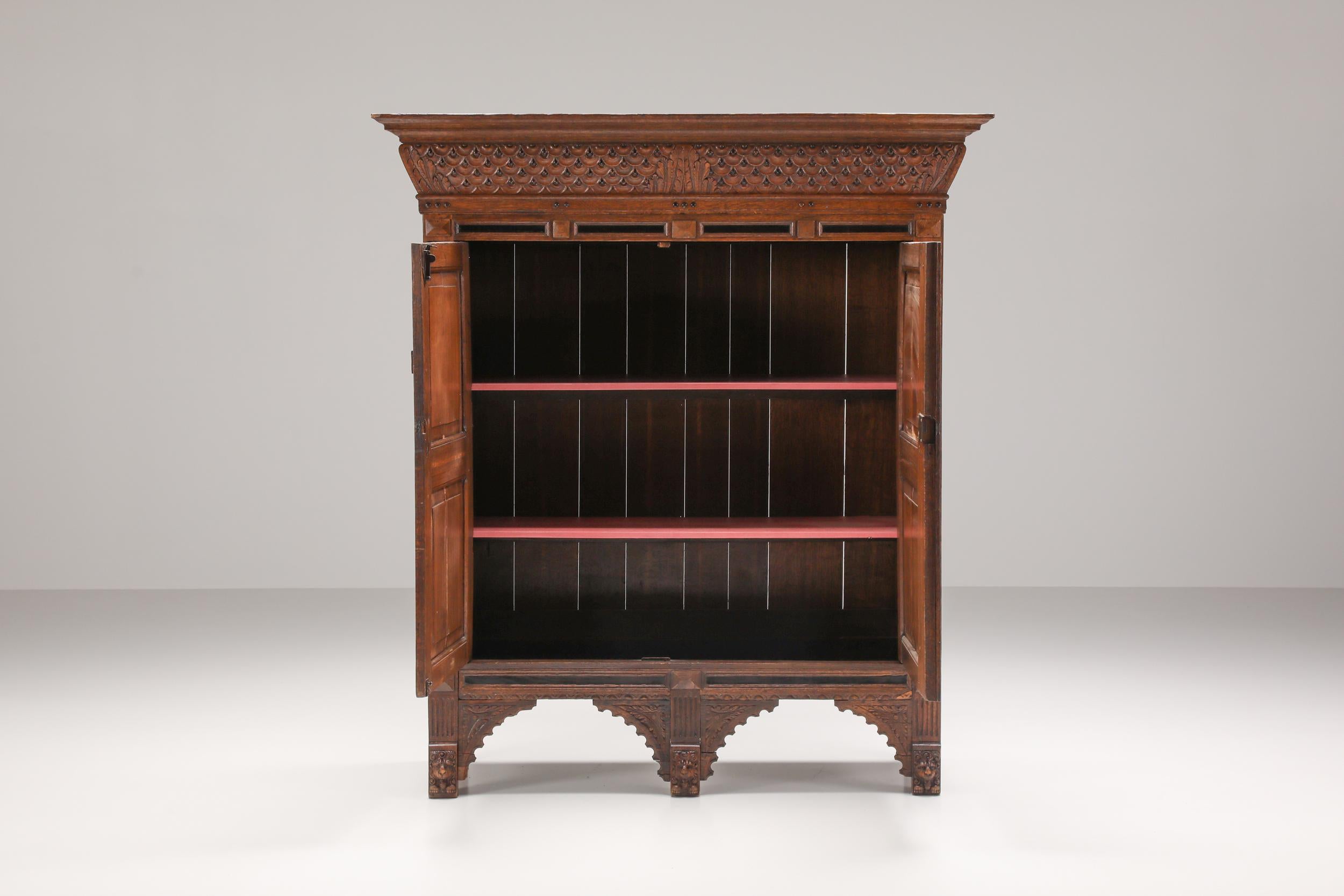 Dutch Renaissance cupboard in wood made in the early 17th century. This historical piece offers two doors open up to three shelves. The incredible hand-made details reflect the craftsman's distinctive vision. The charismatic patina on this storage