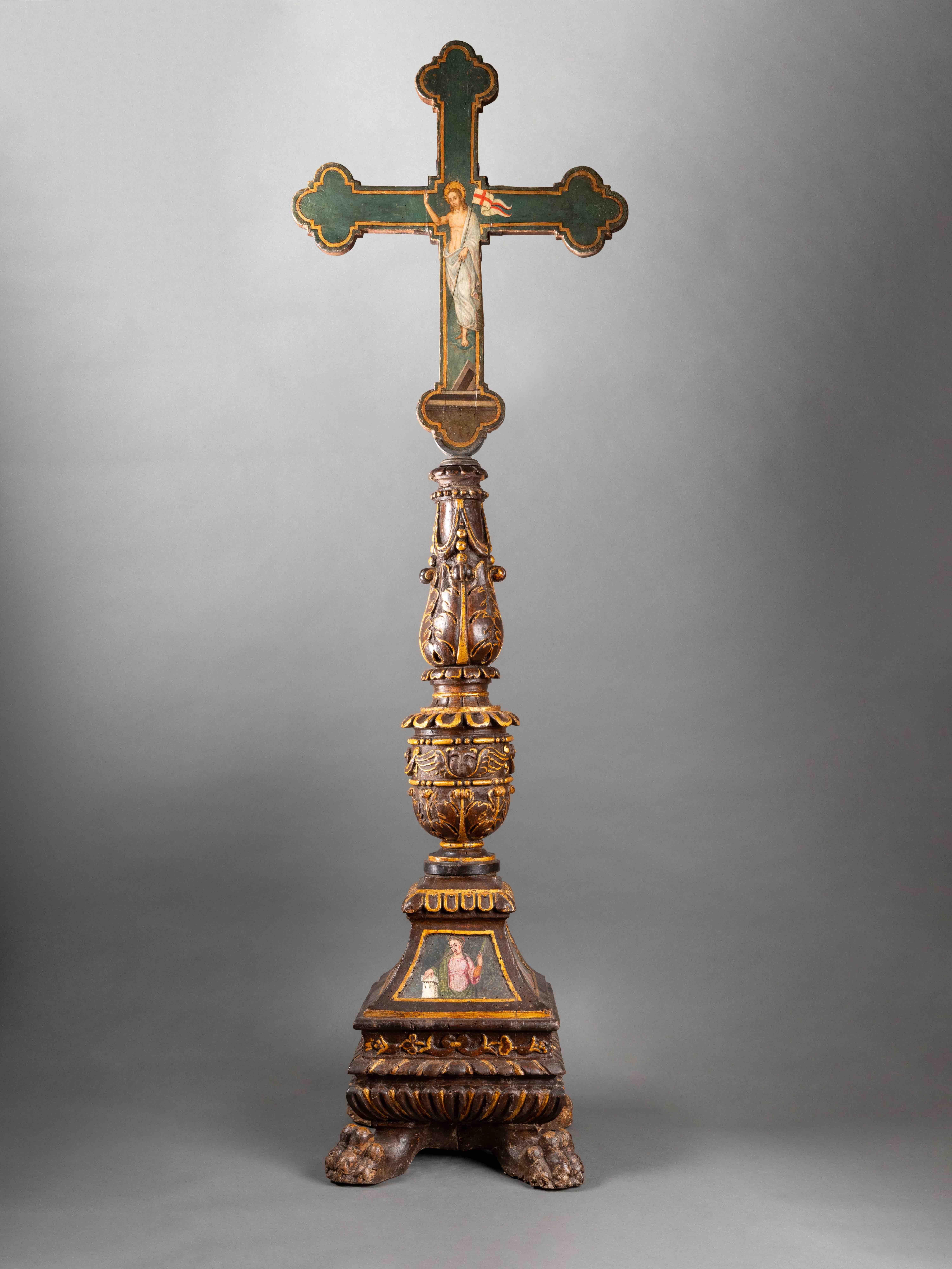 Base of a carved wooden candelabrum, polychrome and gilded; cross  painted on both sides. 
Umbria or Tuscany, 16th century 
136 x 43,5 x 30 cm
(The cross and the base of the candelabrum were later assembled)

The base of the candelabrum is