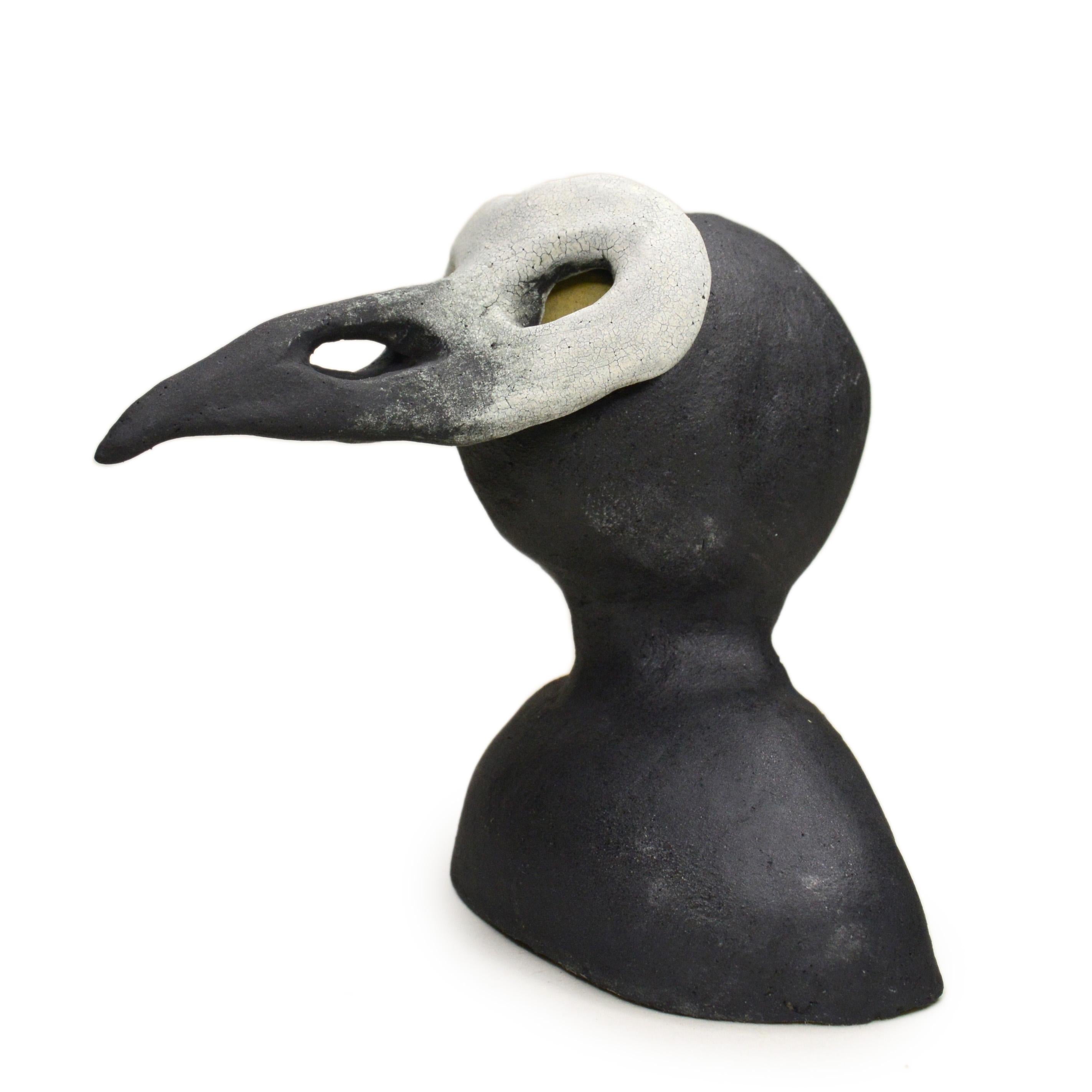 Pineco number 0014 Original Ceramic sculpture with crow mask representing: Intelligence, fierceness and adaptability.

Meet a variety of characters with distinct masks and postures. These sculptures are fascinating and make you curious, encouraging