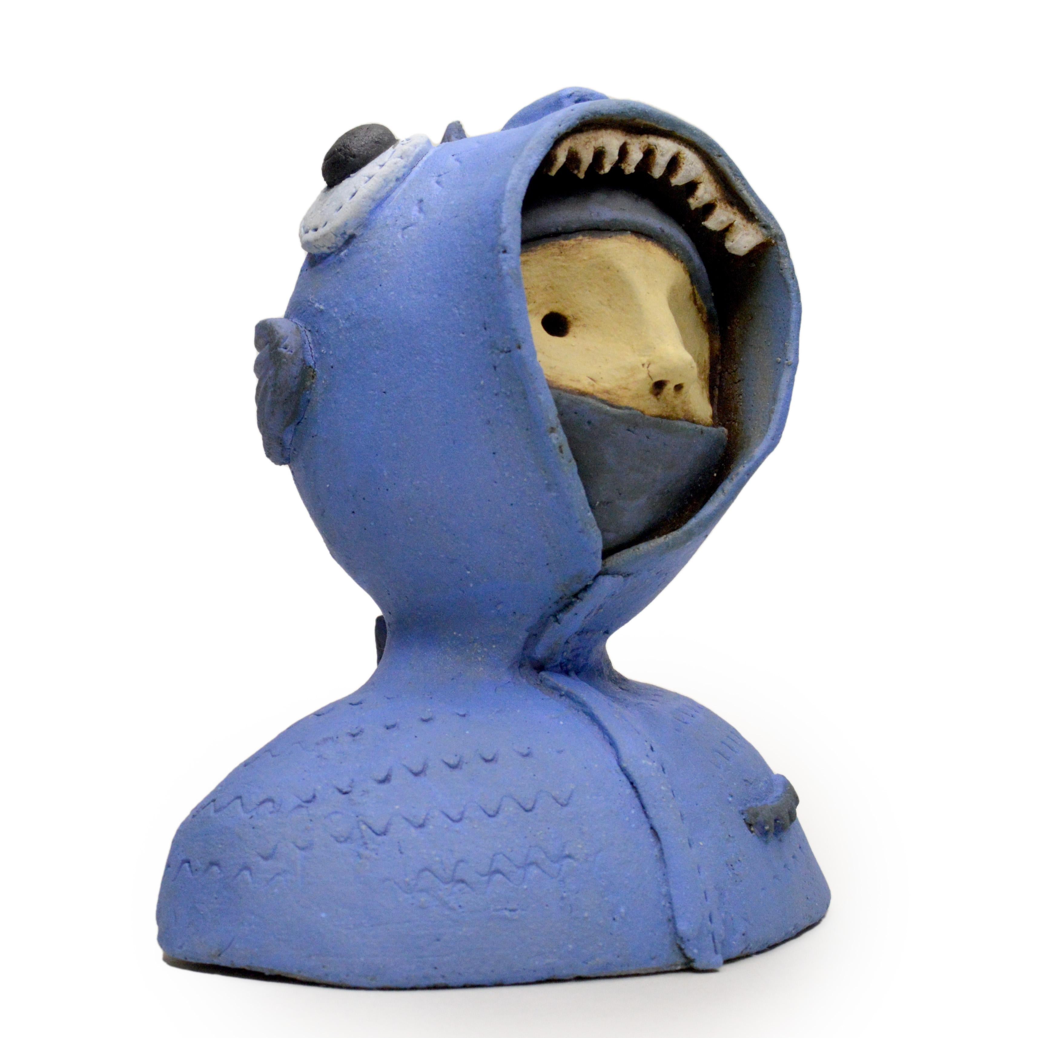 Pineco number 0019 Original Ceramic sculpture with a fish hoodie

Meet a variety of characters with distinct masks and postures. These sculptures are fascinating and make you curious, encouraging you to explore the intricate world of human emotions.