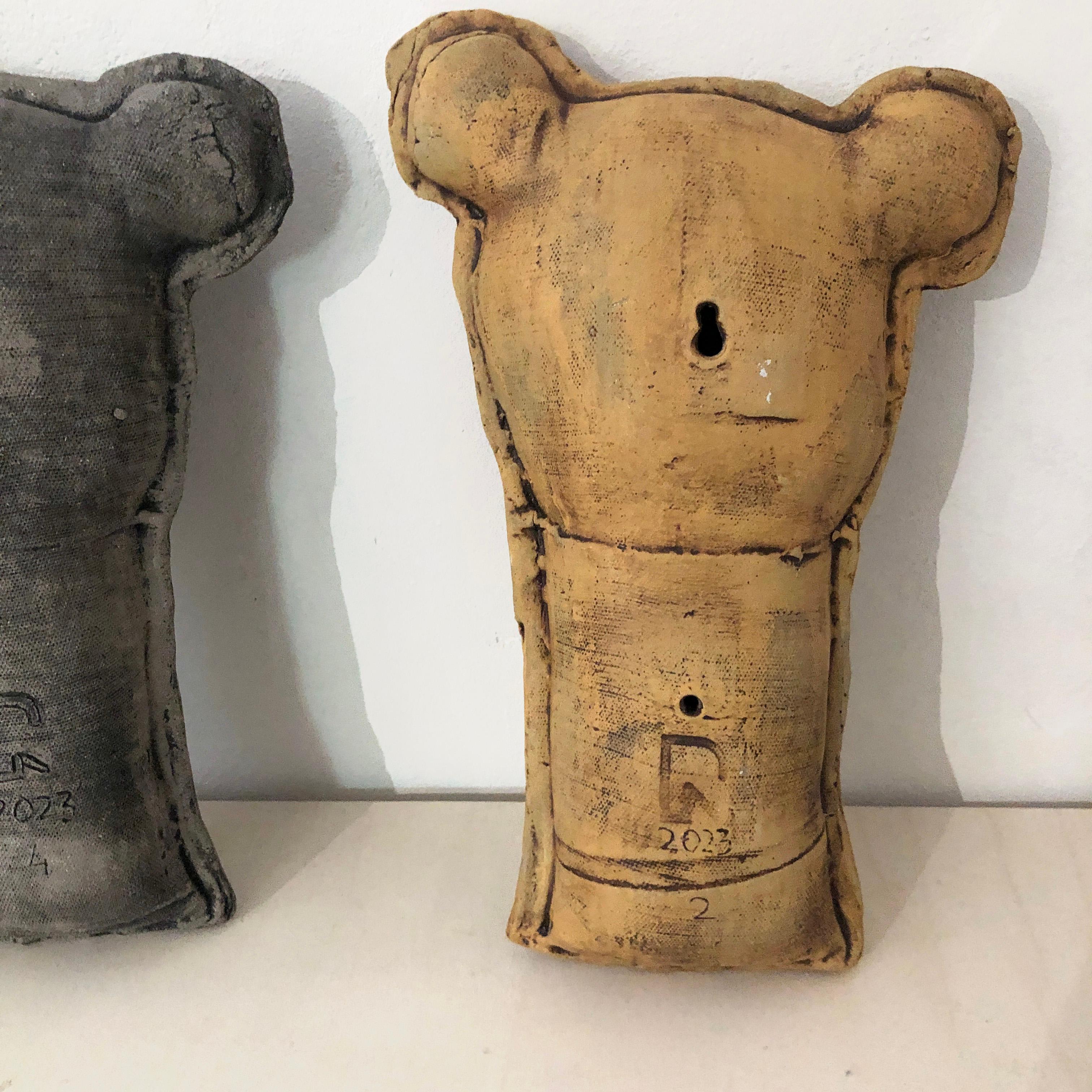 Introducing Théodora Béatrice the first or simply Teddy B, a cute ceramic teddy bear to hang on your wall. 

Combining contemporary aesthetics with a touch of rebellion and  urban charm. Crafted by the skilled hands of Renate Frotscher, this modern