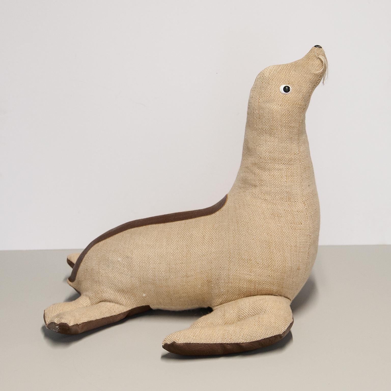 Therapeutic toys Seal manufactured and designed by Renate Müller in the 1970s in the GDR. The toys are handmade from ecologically acceptable materials in typical use of jute and colored leather. This makes these animals age quite characteristically