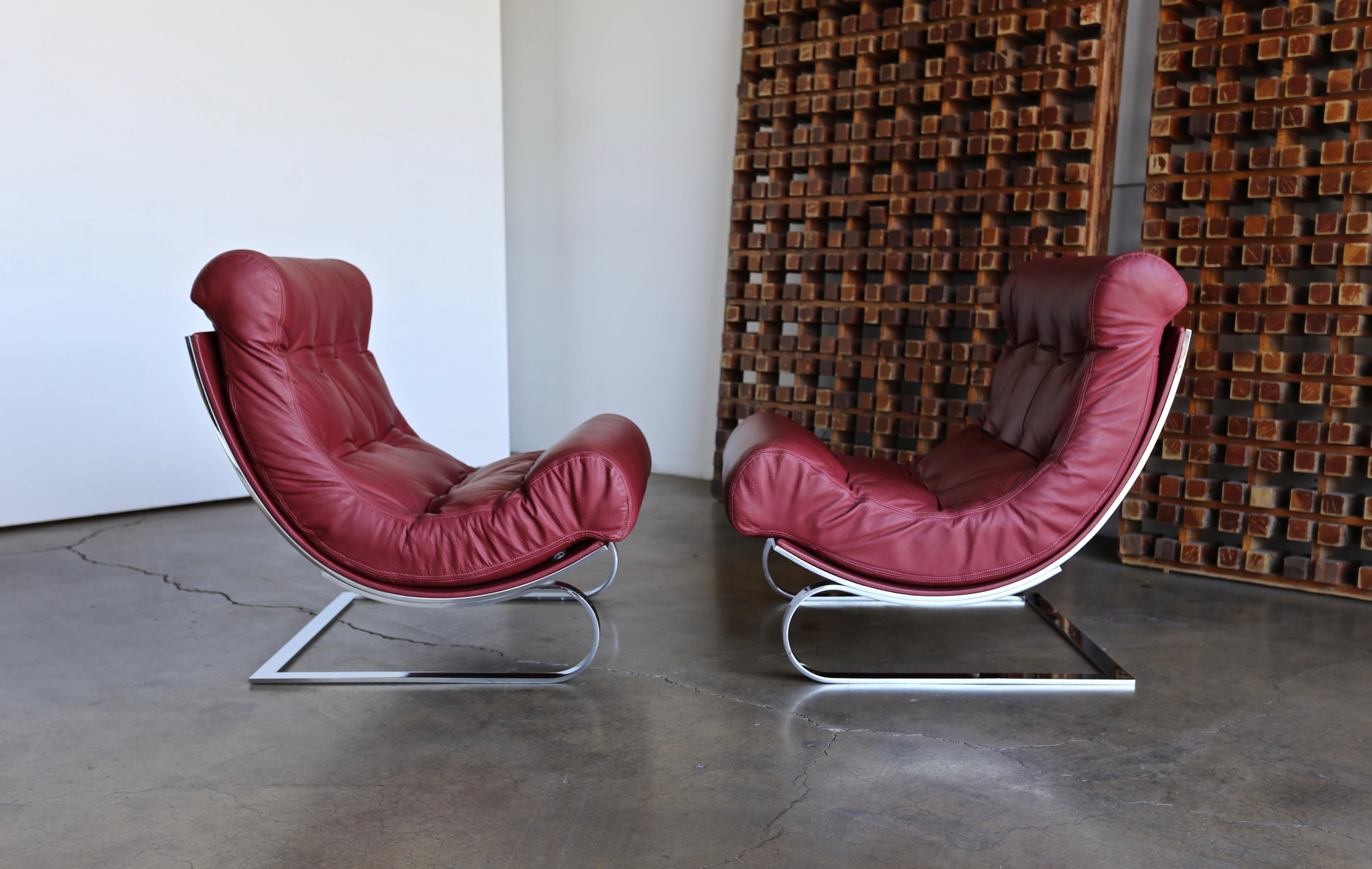 Renato Balestra leather lounge chairs for Cinova Italy circa 1970. This pair is in very good original condition. A really comfortable pair of chairs.