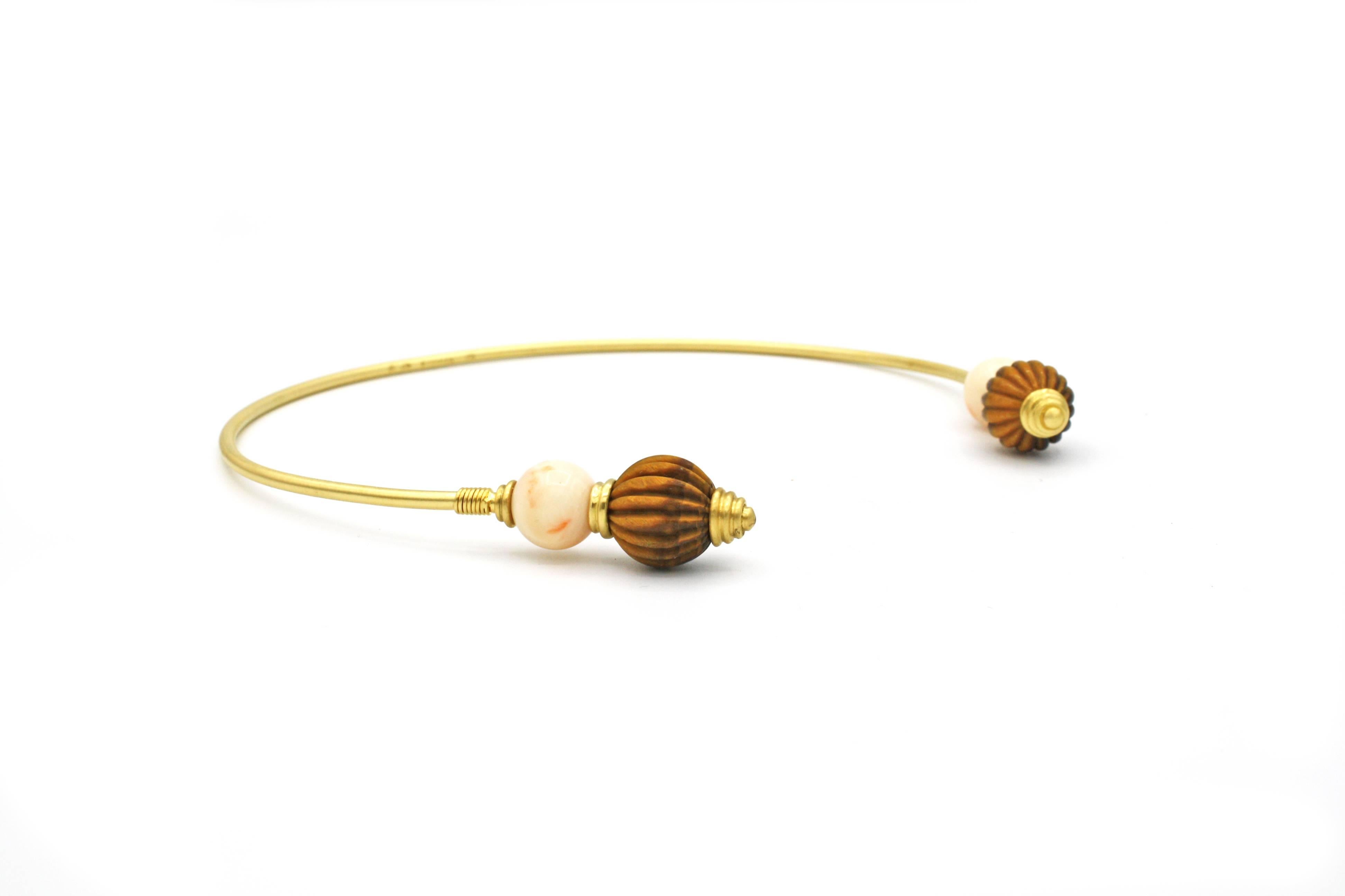 A chic and versatile 18k gold necklace with rare Angel Skin coral spheres and larger Tiger's Eye spheres, as well as Roman inspired details. Part of Renato Cipullo's Bocce Collection, inspired by the Ancient Roman game of Bocce Ball.