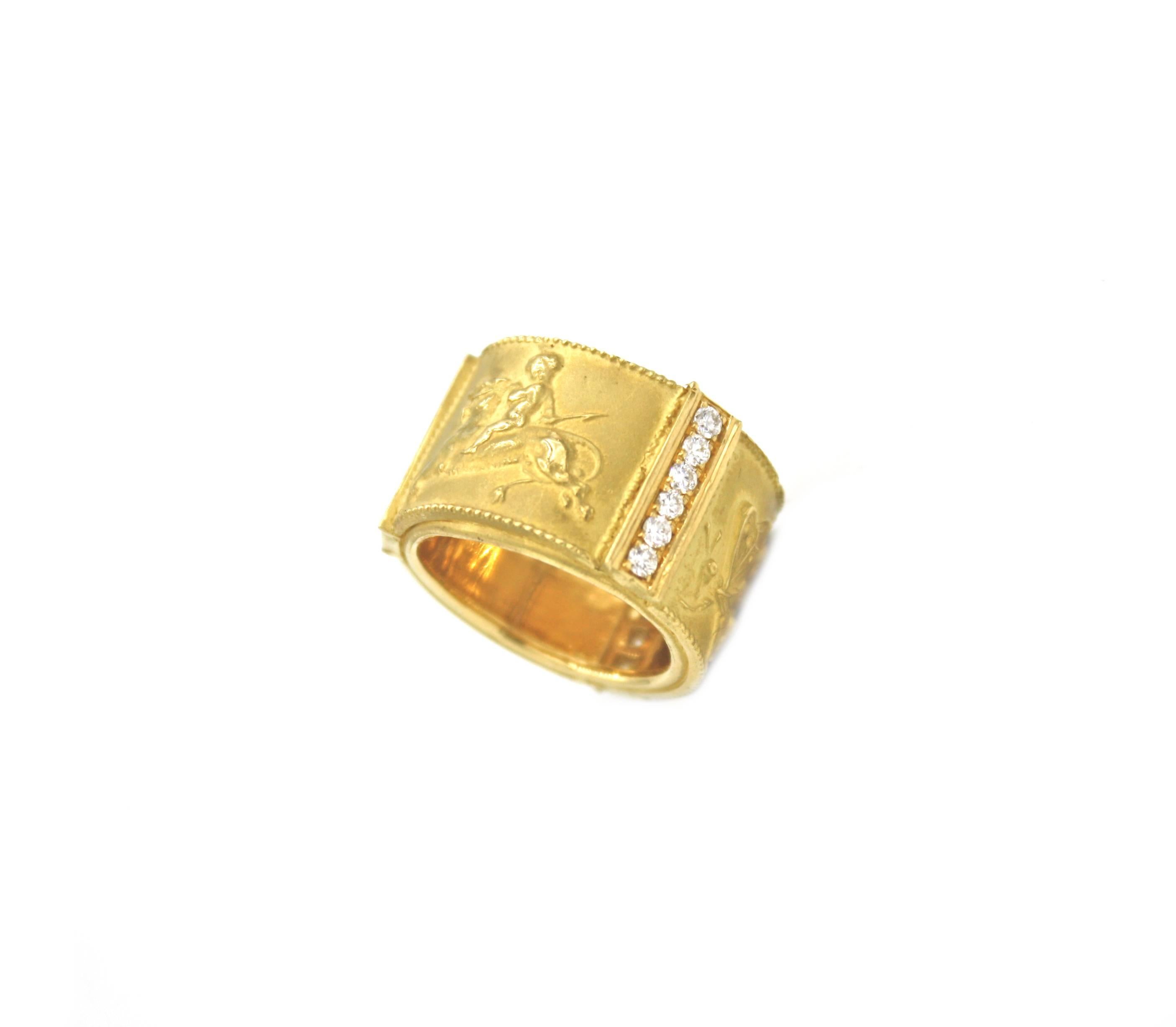 18k Yellow gold band ring with three panels featuring Cupids separated by three columns of diamonds, a great piece for a statement or a unique wedding band. Part of Renato Cipullo's 