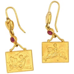 Renato Cipullo Ruby and Gold Cupid Earrings
