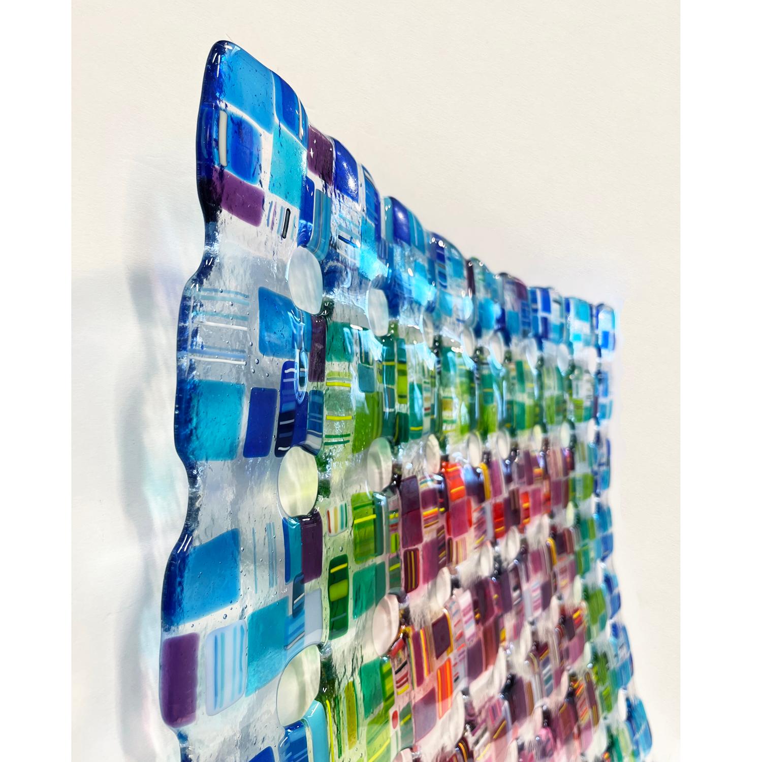 This stunning fused glass wall sculpture by Renato Foti is composed entirely of glass. The 3D sculpture can be hung as a square or a diamond from the provided hooks.

Renato Foti received his BFA from the University of Western Ontario in 1986,