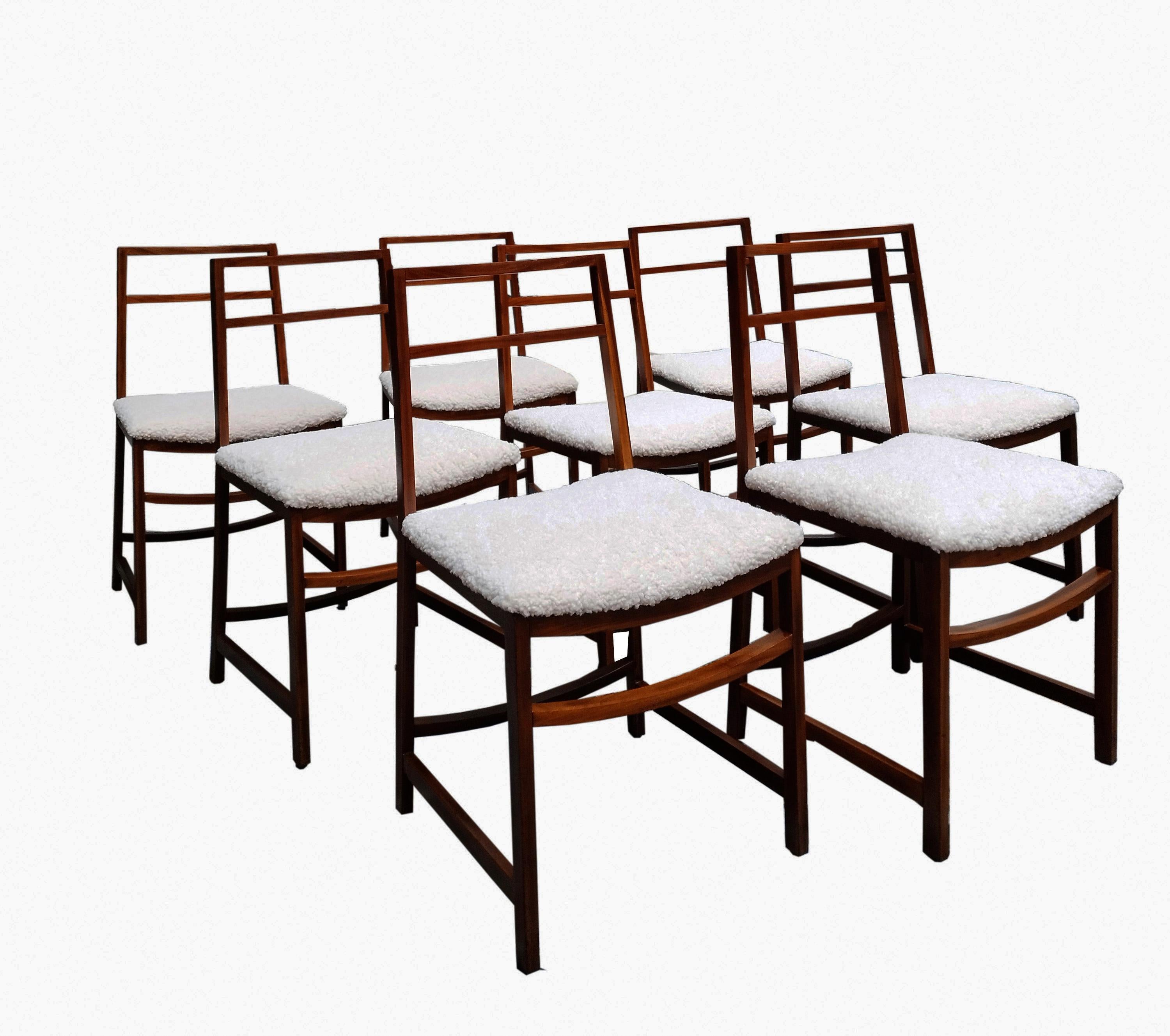 Chairs in wood and boucle fabric by Renato Venturi who designed these extraordinary chairs for MIM Rome in 1960s Italy. These fantastic chairs have a solid wood frame and beautifully new ivory boucle'fabric seats. Comes with the original MIM Roma