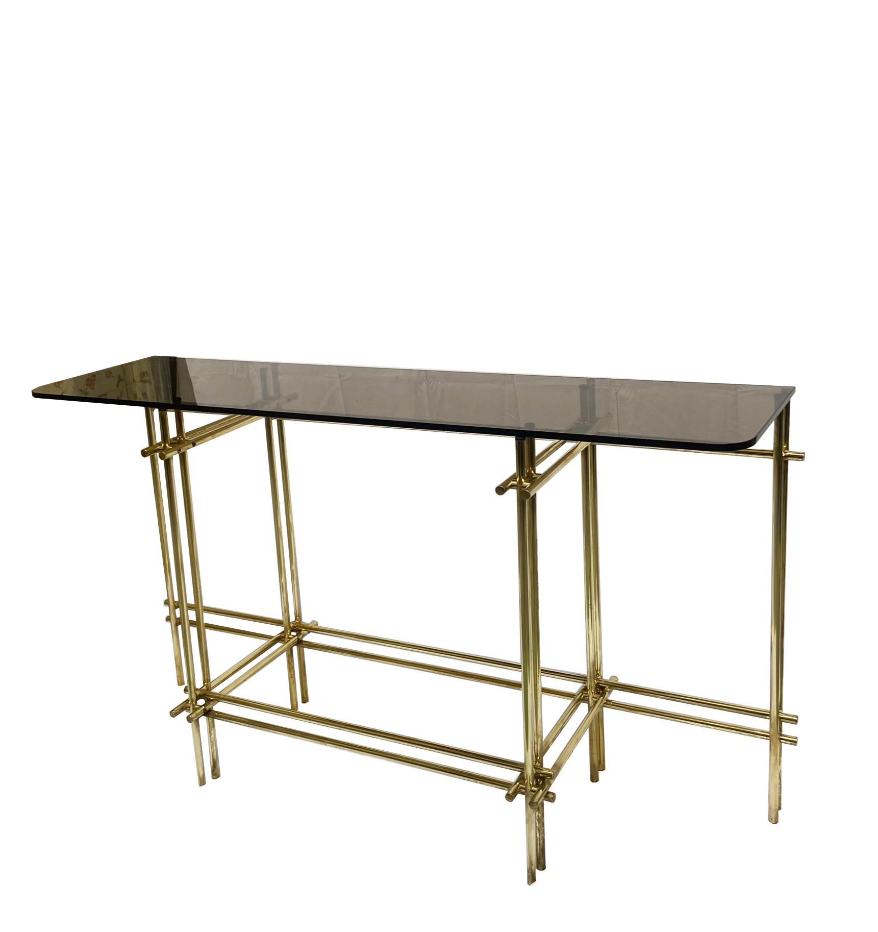 Magnificent console in brass and smoked glass designed in the 1970s by Renato Zevi.