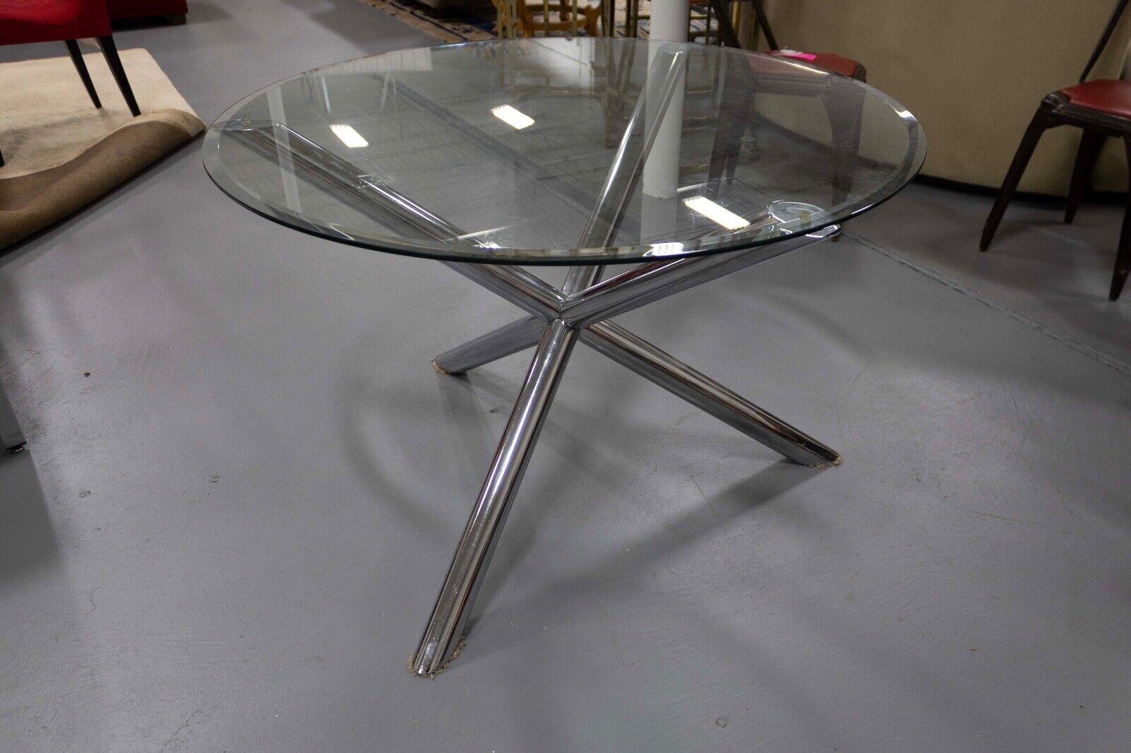 The Renato Zevi Dining Circular Dinette Chrome Table is a brilliant example of contemporary modern design, showcasing a perfect blend of style and functionality. Its circular design and chrome base create a striking and visually pleasing centerpiece