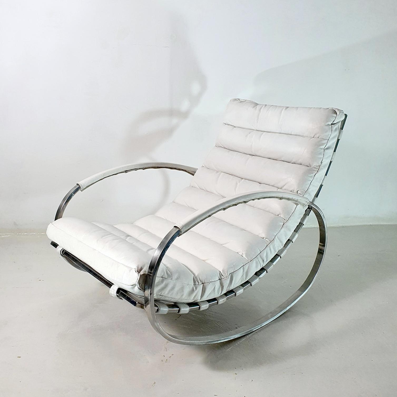 The Ellipse rocking chair designed by Renato Zevi for Selig, Italy 1970's. Chrome-plated steel frame with original white leather upholstery. The chrome frame has a nice mirrored finish. The leather is original and has not been changed. If that is