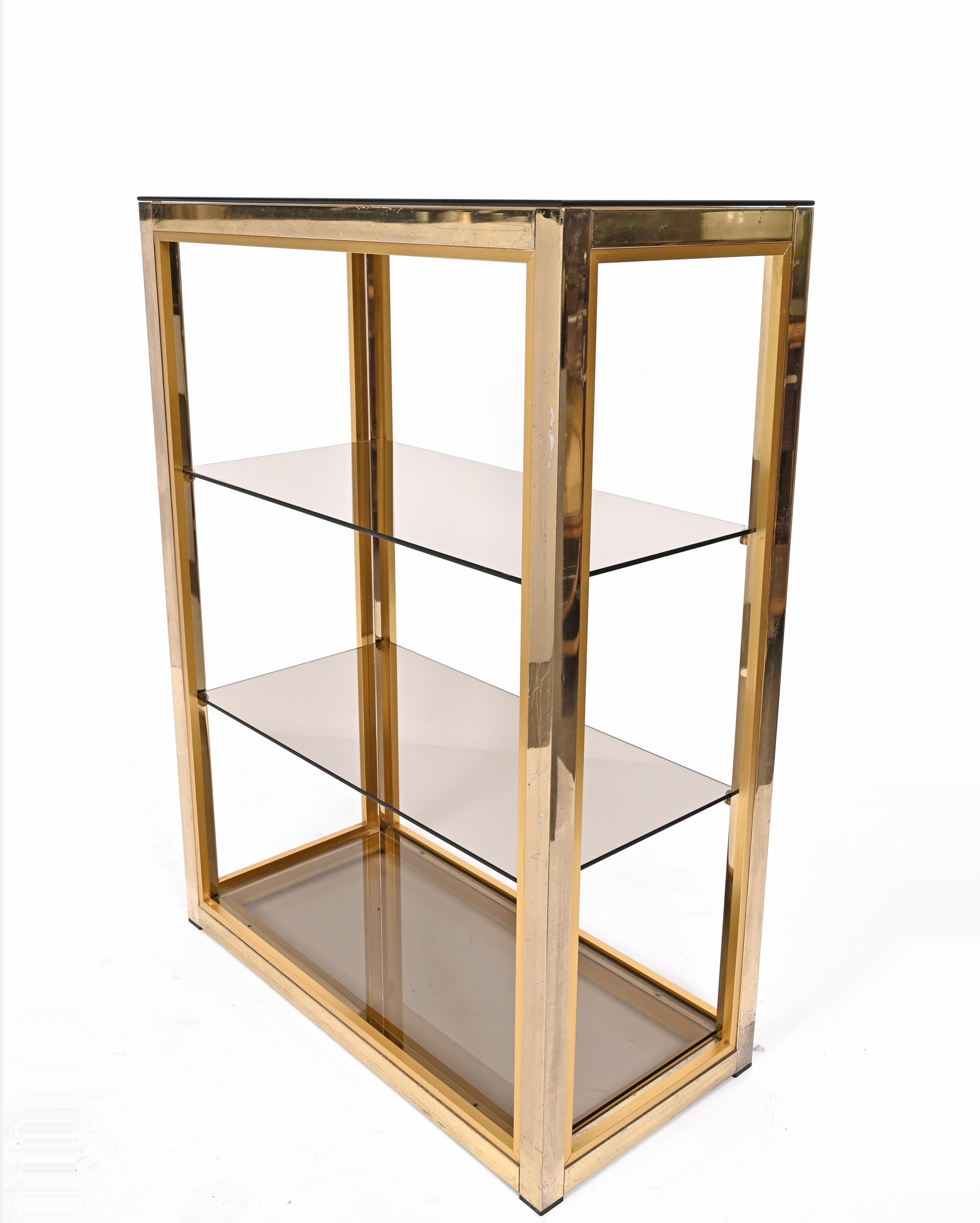 brass bookcase with glass shelves